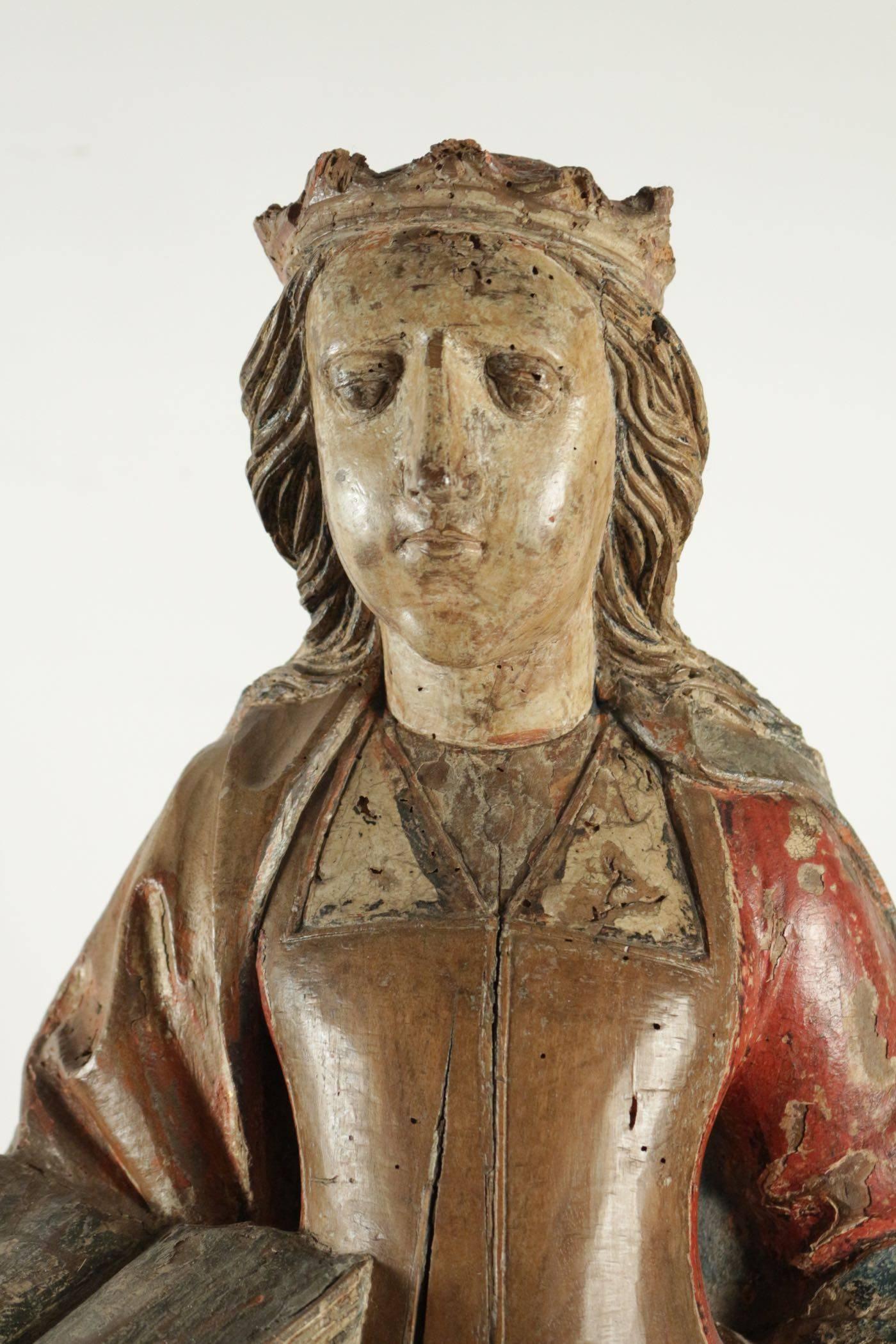 Wooden sculpture of Saint Catherine in walnut with traces of original paint. Dated 16th century-beginning of the 17th century.
Measures: H 92cm, L 35cm, P 21cm.