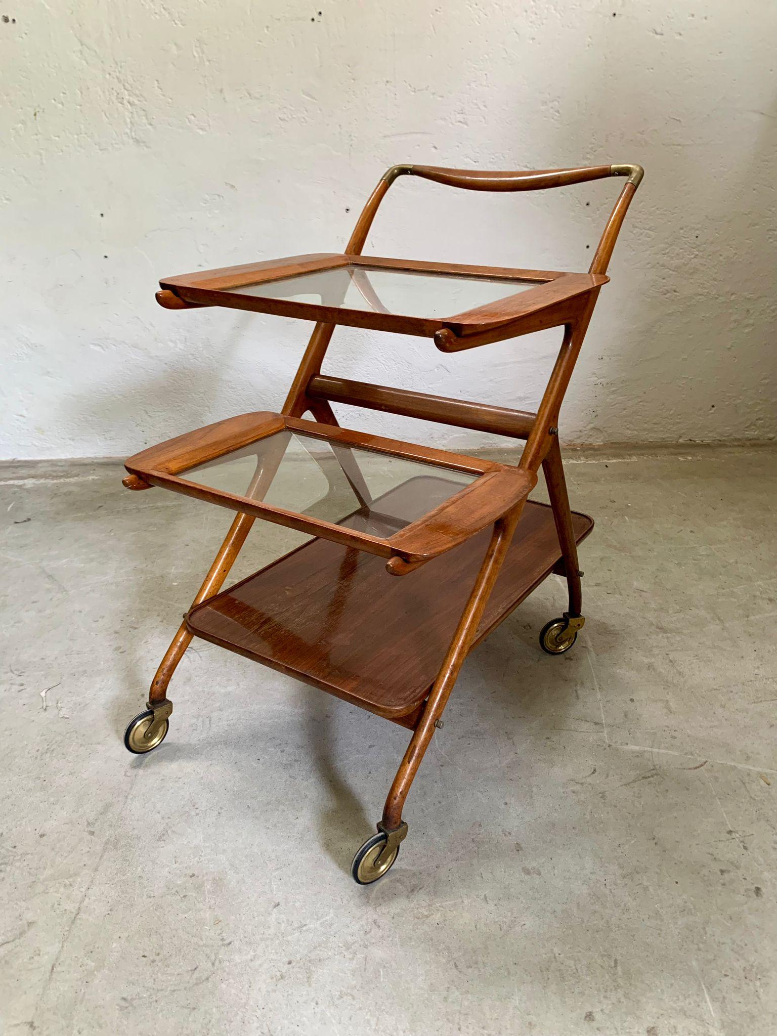Wooden service trolley model 65 design by Ico Parisi, 1950s, Italy
Solid wood frame, brass details and two removable beveled glass tops with integrated handles (the last shelf is wooden).
Refined lines and functionality typical of postwar Italian