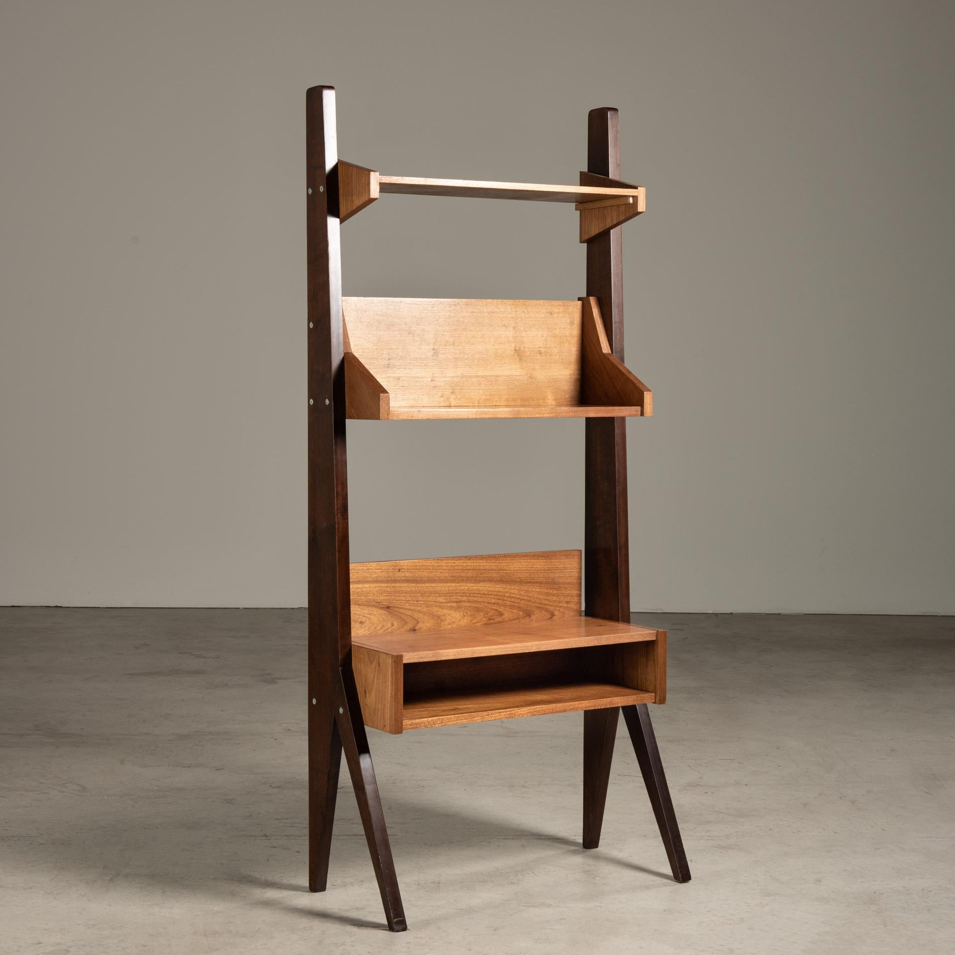 This wooden shelf is a fine example of Brazilian design from the mid-20th century, by Zanine Caldas, who was known for his use of organic materials and innovative approaches to woodworking.

The shelf is characterized by a simple yet sophisticated