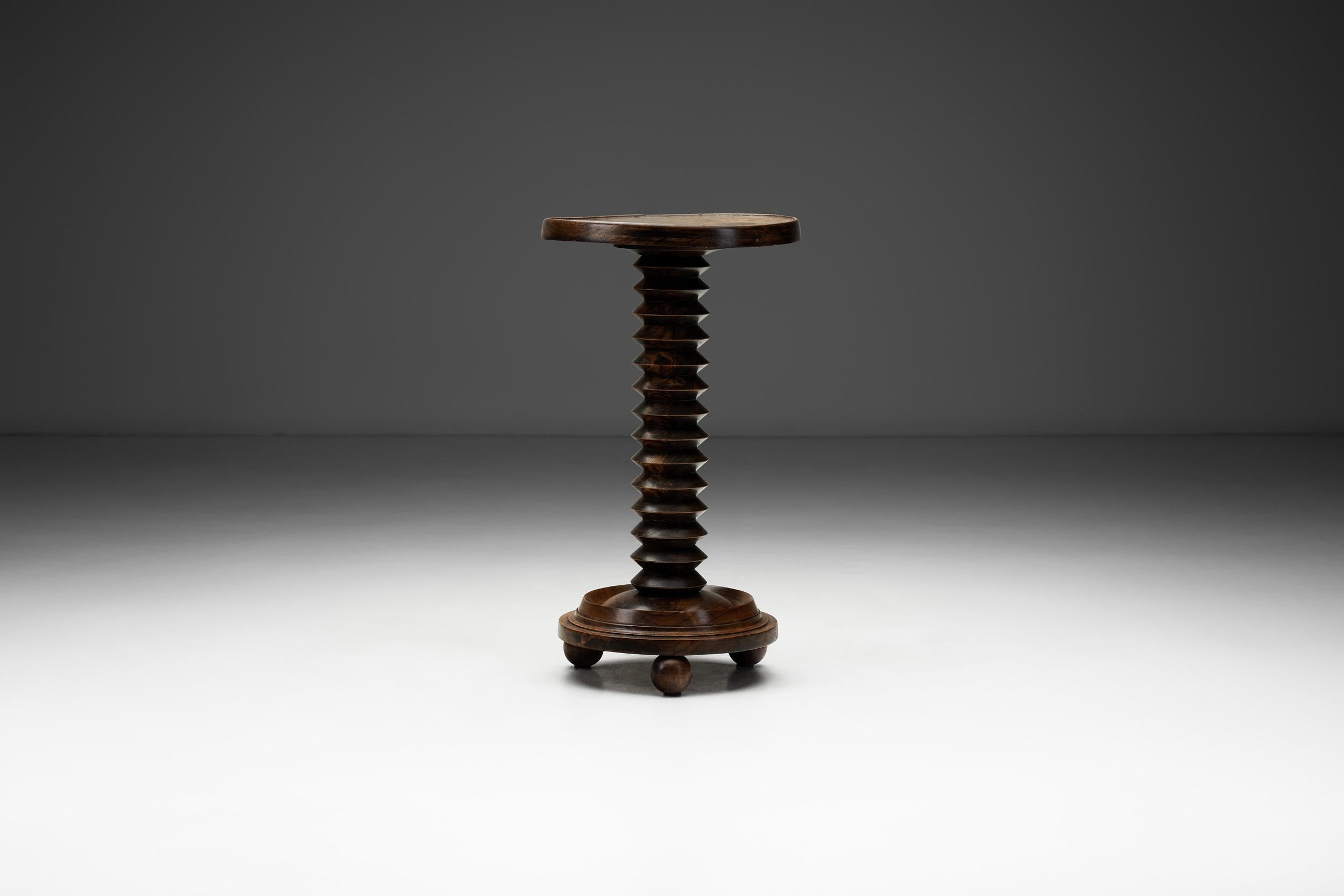In the 1940s, French design experienced a shift toward robust craftsmanship and expressive, sculptural forms. Among the key figures of this era was Charles Dudouyt, known for his bold use of solid wood, rhythmic carving, and rustic modern