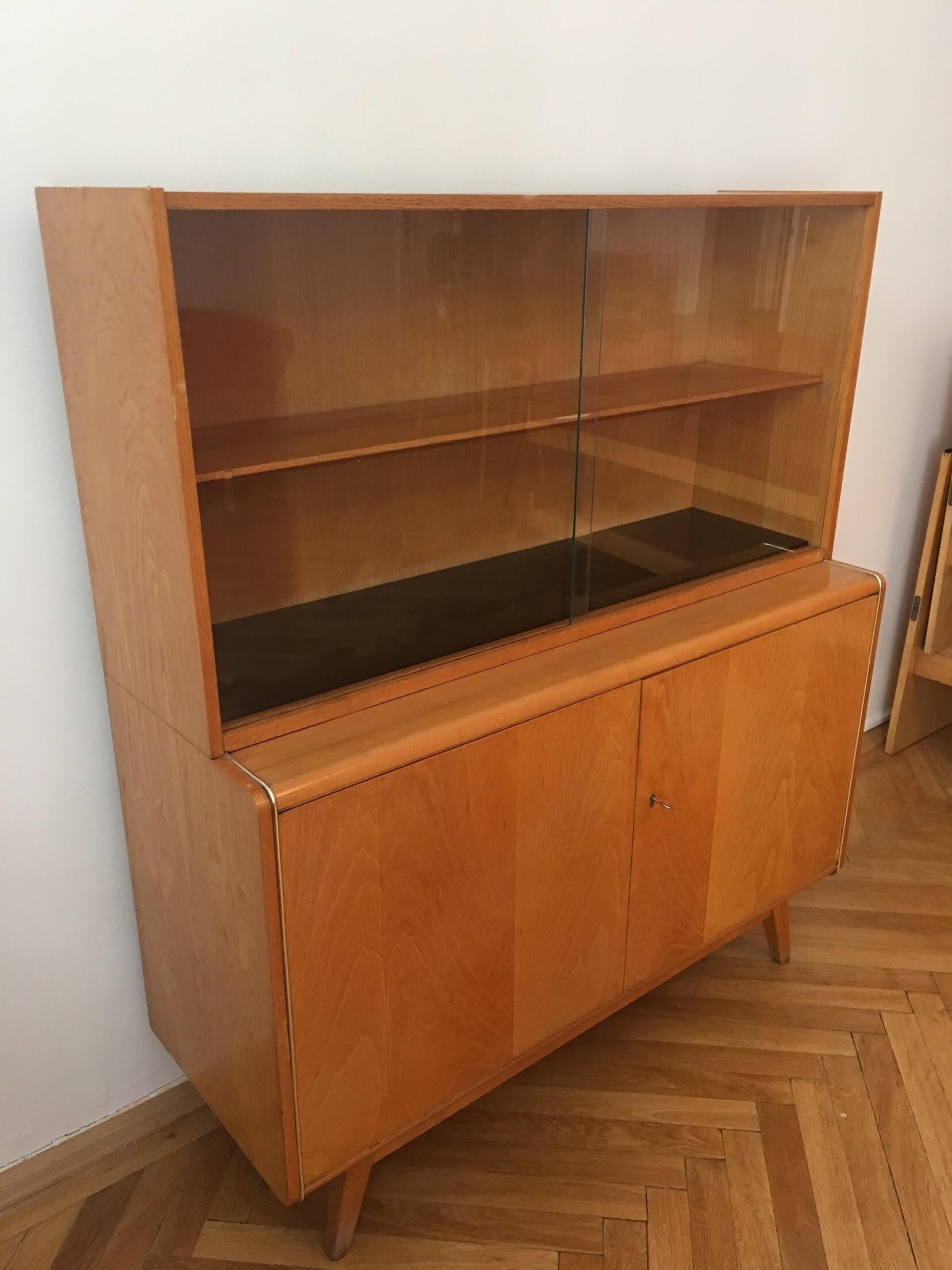 Sideboard with Bookcase from 1960s – like a brand new. Perfect condition.
Made in Czechoslovakia in town Sobeslav – brand Jitona. 
Designer Bohumil Landsman, Hubert Nepozitek
Measures: Length: 118 cm
Width: 43 cm
Height: 136 cm.