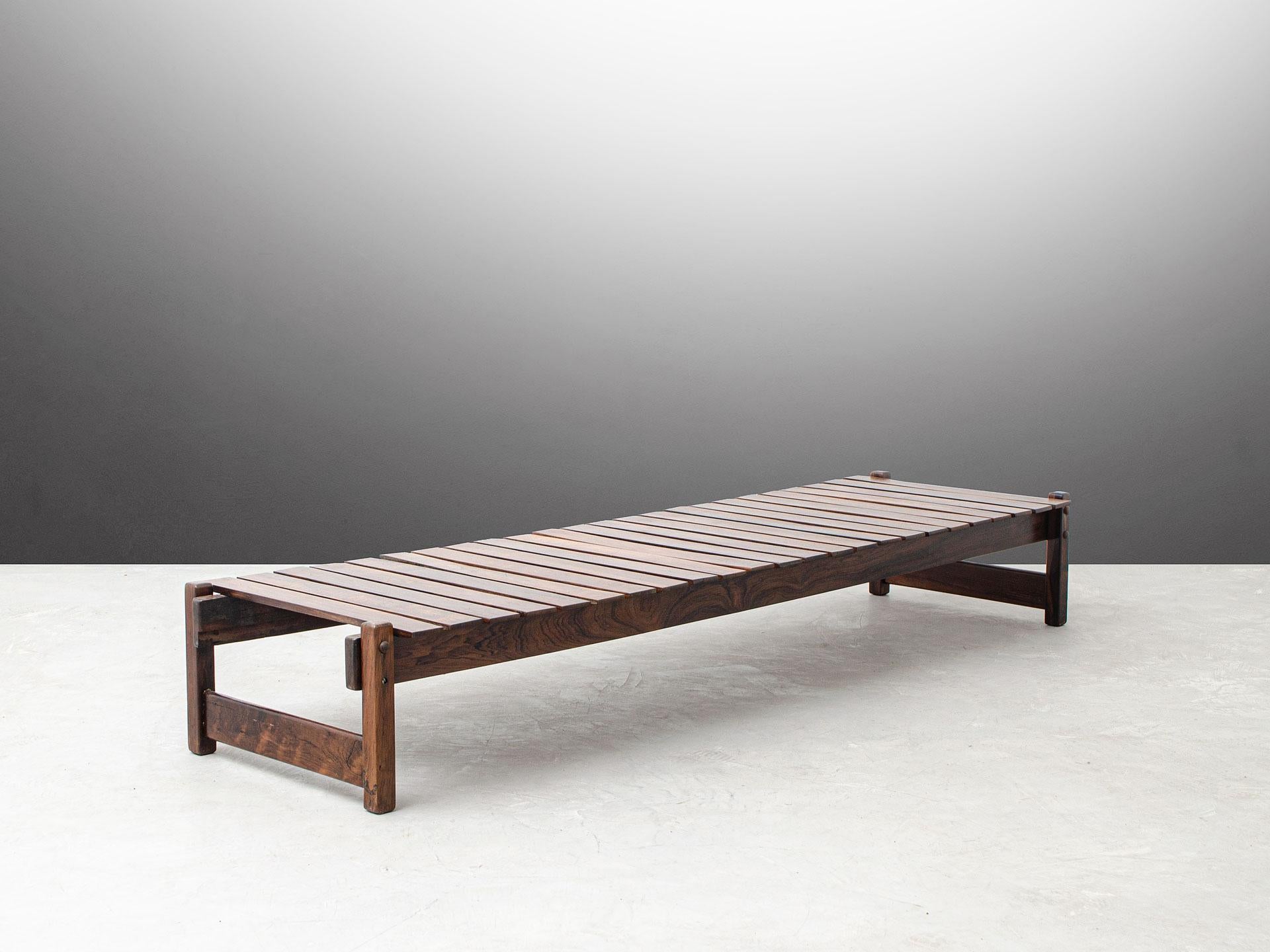 This is an outstanding bench that is definitely an eye-catcher. The design of the beautiful Brazilian hardwood structure combines beautifully with the minimalistic design. The time marks can be seen on the surface of the nice patina. This piece is