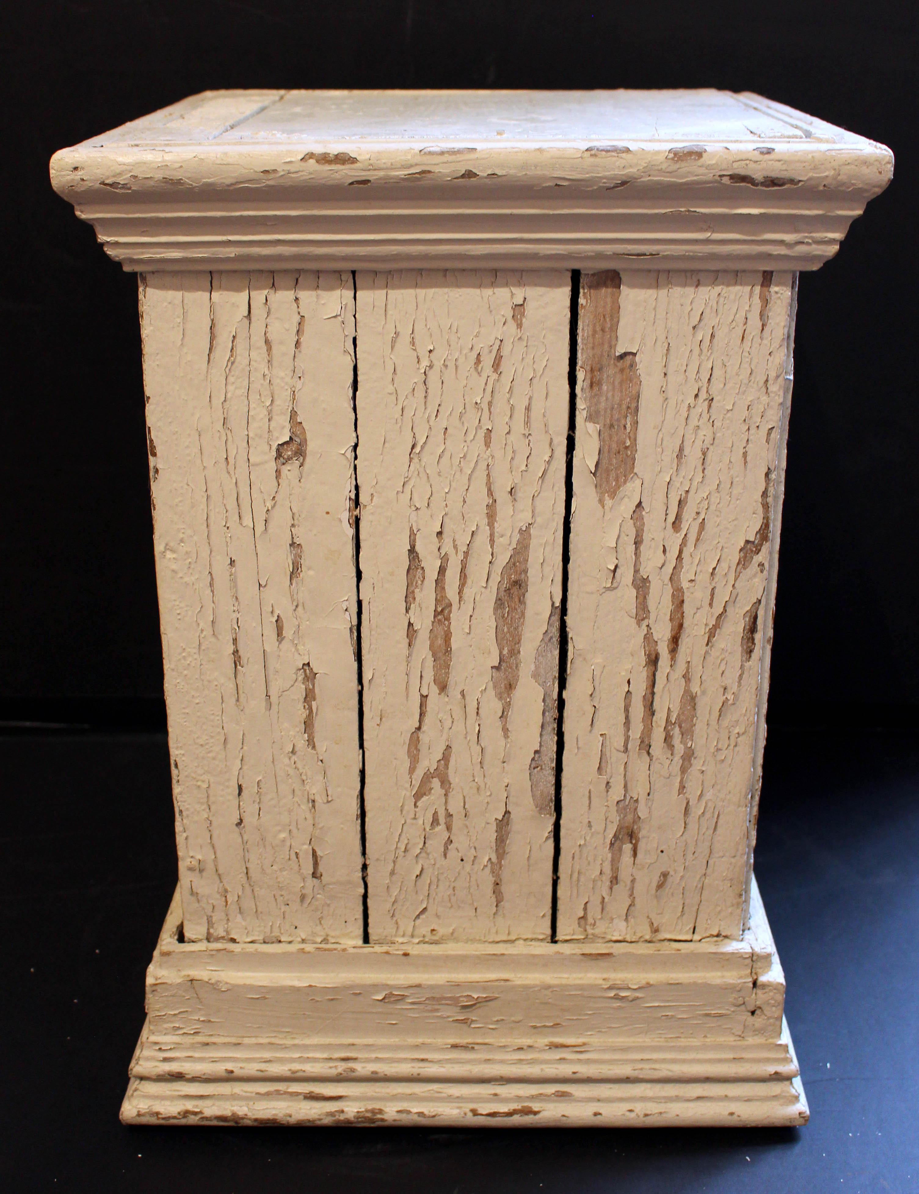 Wooden square plinth display pedestal, vintage, American. Charming old layers of worn paint.  Well molded top & base.
14.25