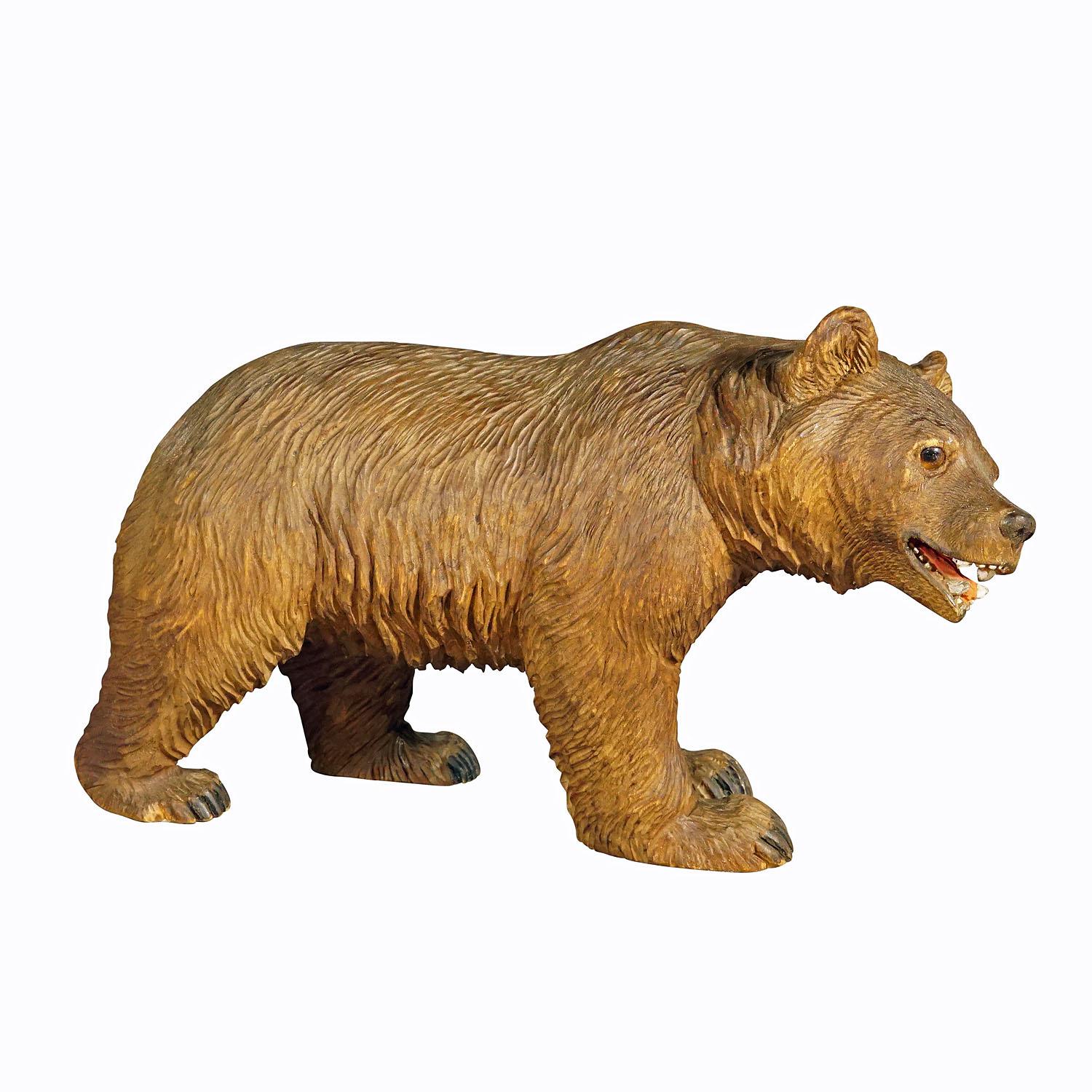 Wooden Statue of a Walking Bear Handcarved in Switzerland circa 1930s.

A vintage statue of a strolling bear. Made of lindenwood, finely handcarved and handpainted with naturalistic details in Brienz, Switzerland ca. 1930s. A nice example of the