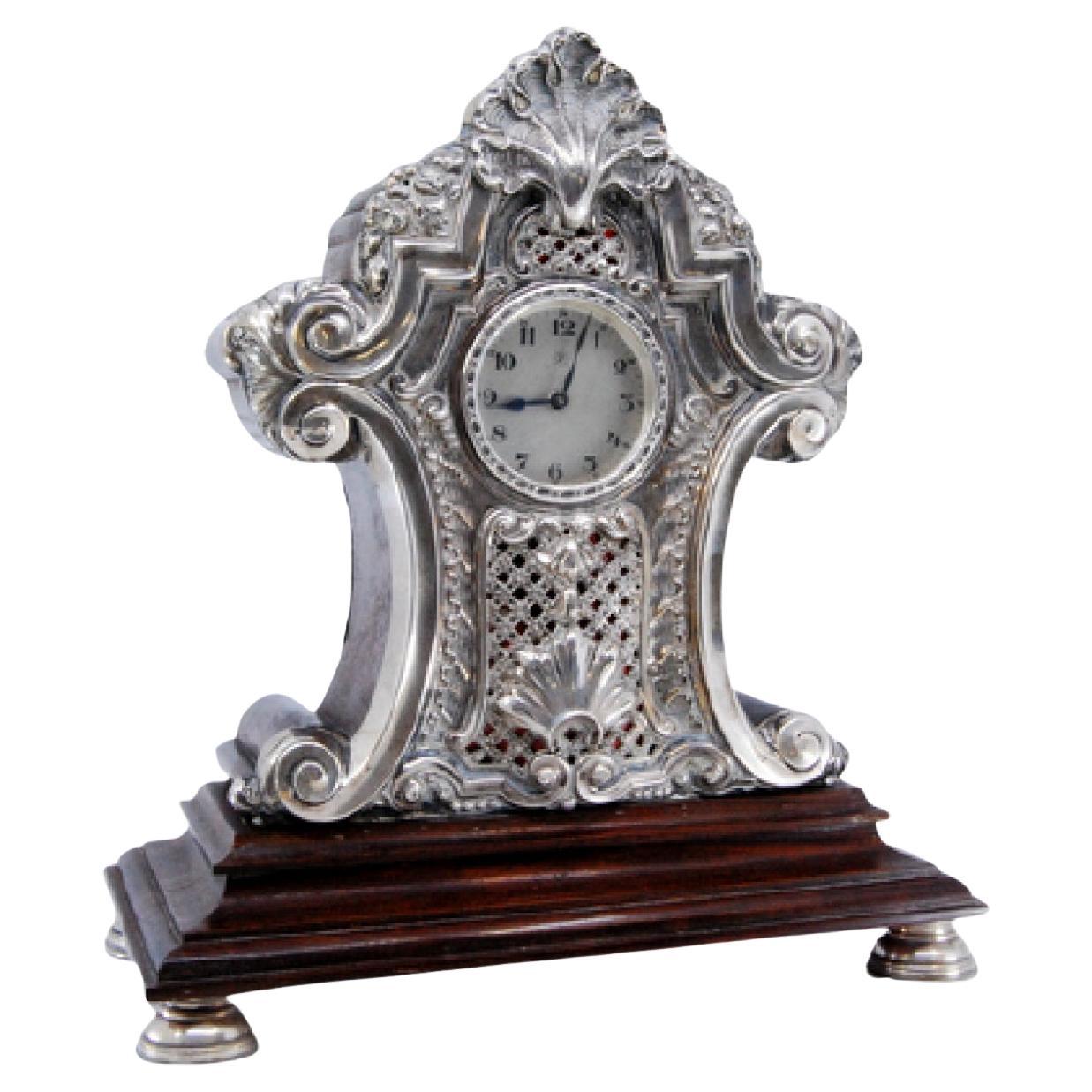 Wooden table regulator clock w/ silver applications 
4 circular support bases For Sale
