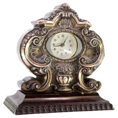 Wooden table regulator clock w/ silver relief application 
rosewood tremolos