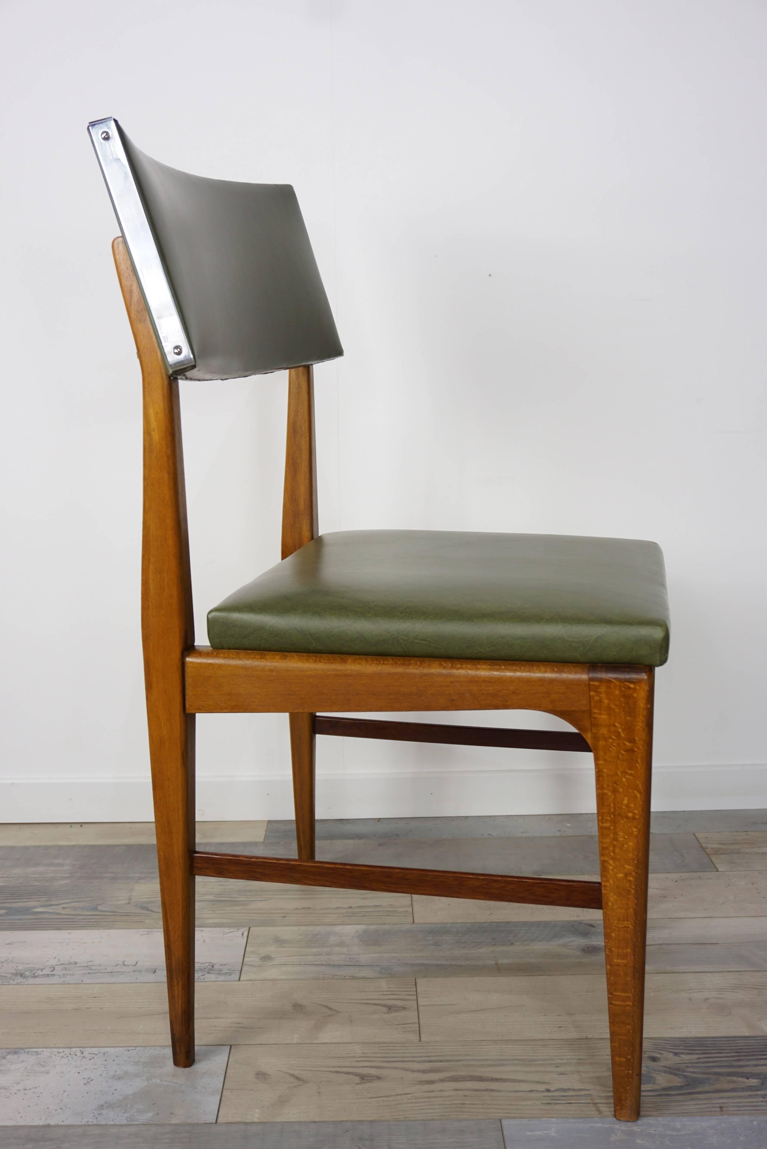Wooden teak and green faux leather Scandinavian style Dutch design chair.