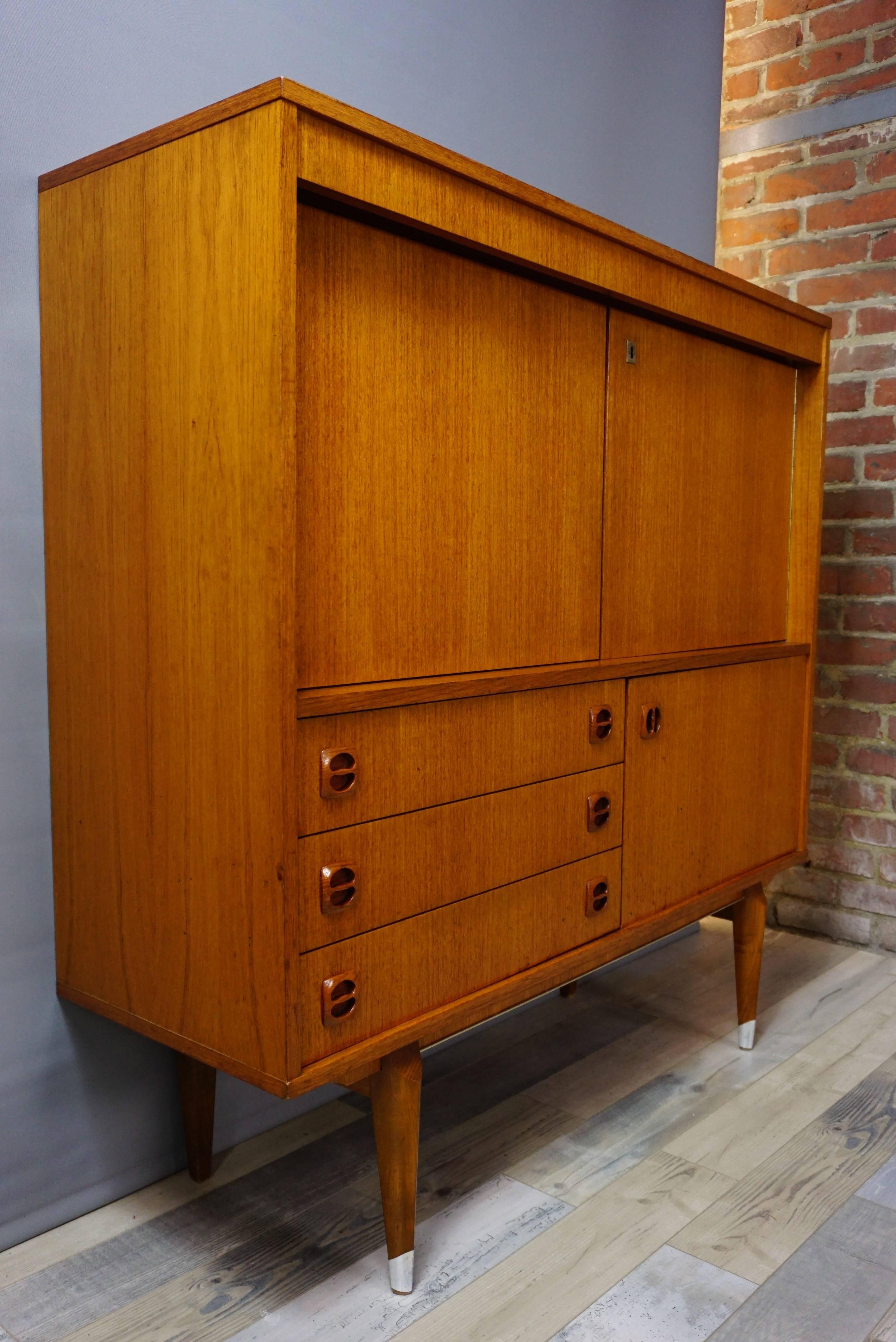 Wooden teak and midcentury Dutch design midboard with a retro look and an unmistakable Scandinavian style. Many storage and beautiful spaces, ideal dimensions, all in very beautiful conservation.