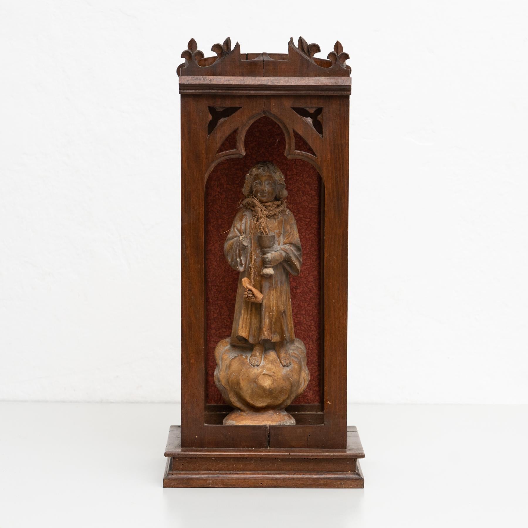 Traditional religious signed plaster figure of a virgin in a wooden niche.    Made in traditional Catalan atelier in Olot, Spain, circa 1950.    In original condition, with minor wear consistent with age and use, preserving a beautiful patina. 