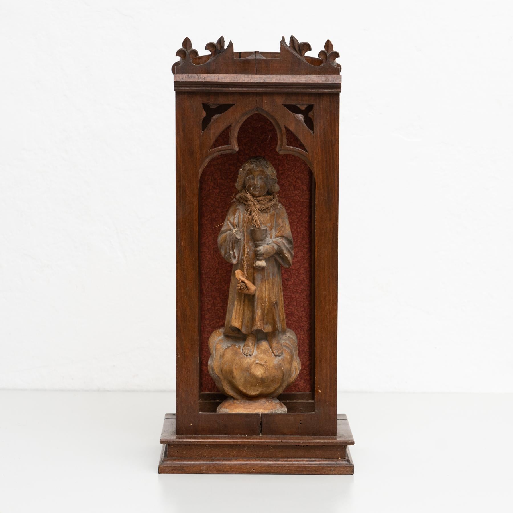 Traditional religious signed plaster figure of a virgin in a wooden niche.

Made in traditional Catalan atelier in Olot, Spain, circa 1950.

In original condition, with minor wear consistent with age and use, preserving a beautiful