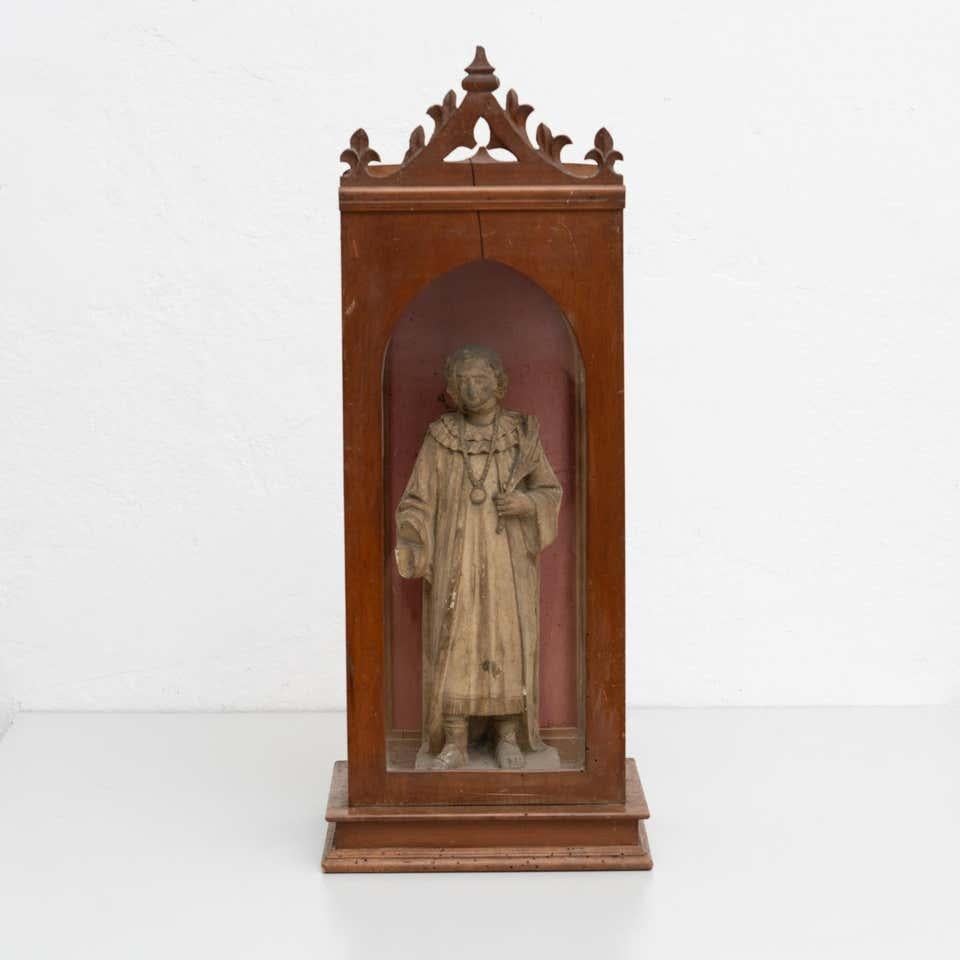 Traditional religious signed plaster figure of a saint in a wooden niche.

Made in traditional Catalan atelier in Olot, Spain, circa 1950.

In original condition, with minor wear consistent with age and use, preserving a beautiful