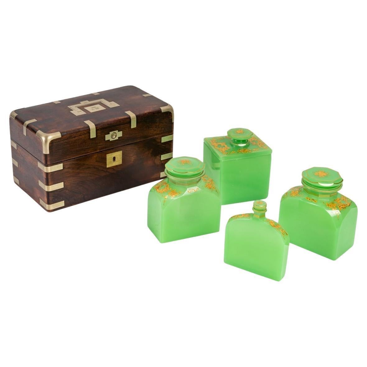 Wooden travel box with green opaline bottles.
19th Century.
Measures: H: 14cm, W: 26cm, D: 15cm.
Ref 2934.