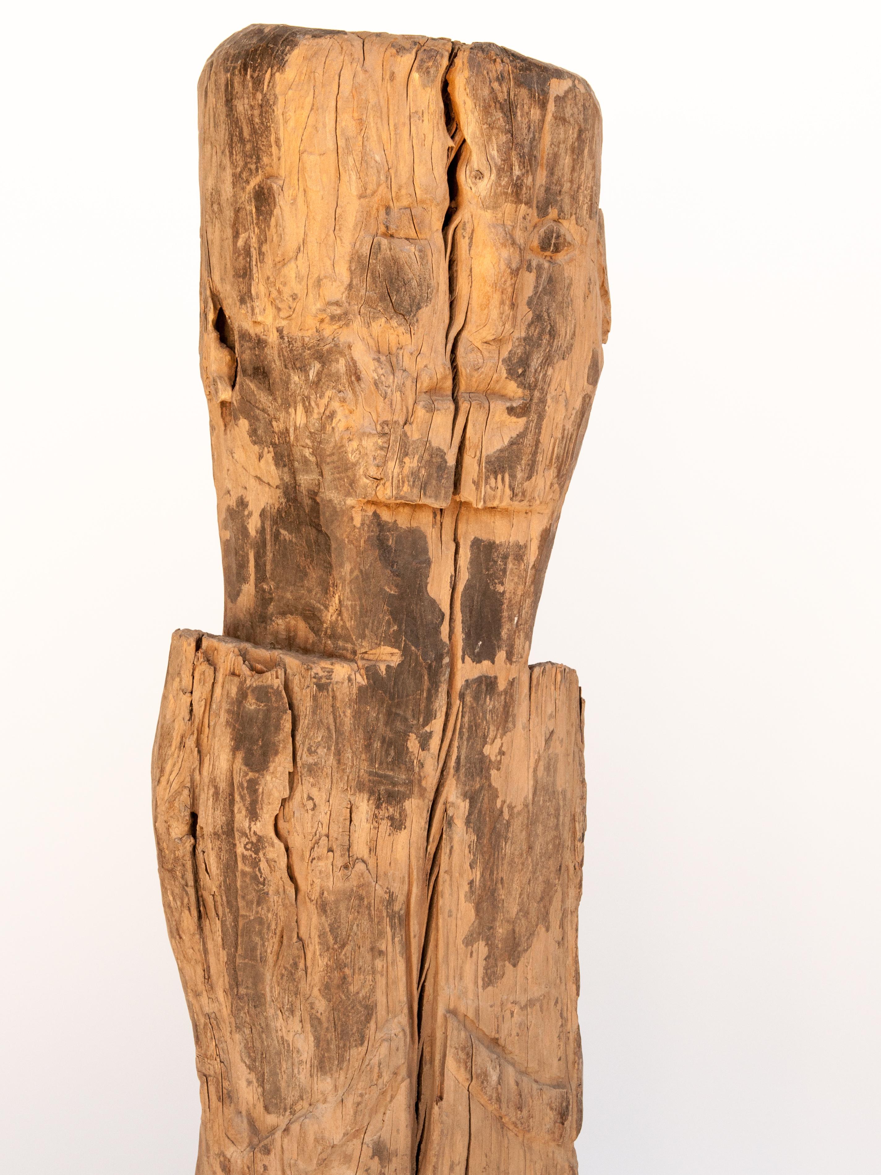 Wooden tribal statue or bridge figure from West Nepal, early to mid-20th century mounted on a metal base.
This wooden figure comes from the West Nepal, and is posed standing with hands together in the traditional Namaste greeting of Nepal. It is