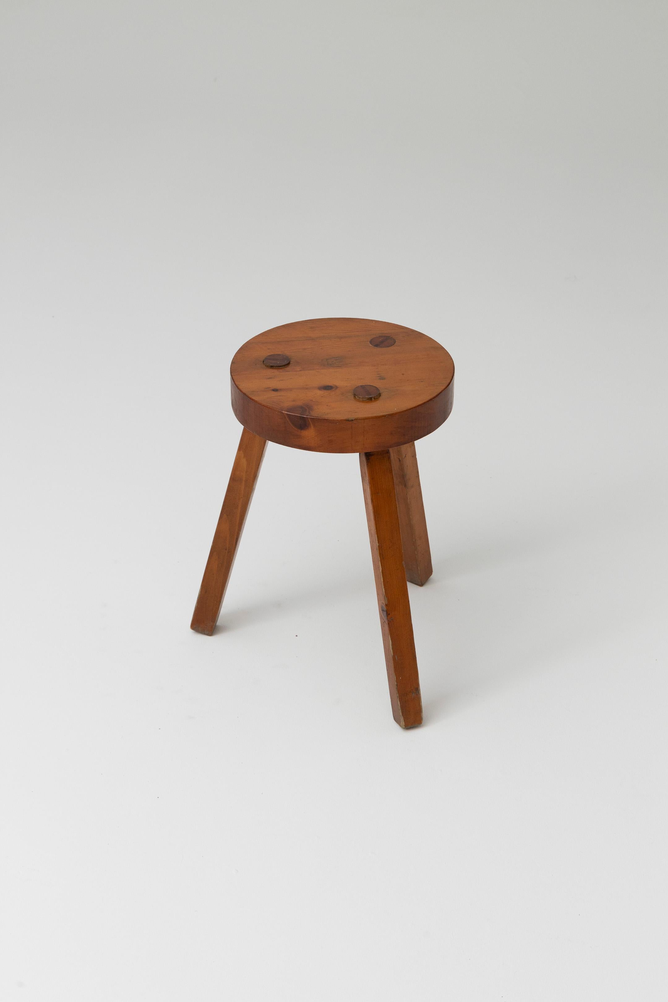 Tripod Stool In Darkened Solid Wood, With Circular Seat. Its Clean Lines Recall The Aesthetics Of Brutalism. Slight Traces Of Use. Good Condition.