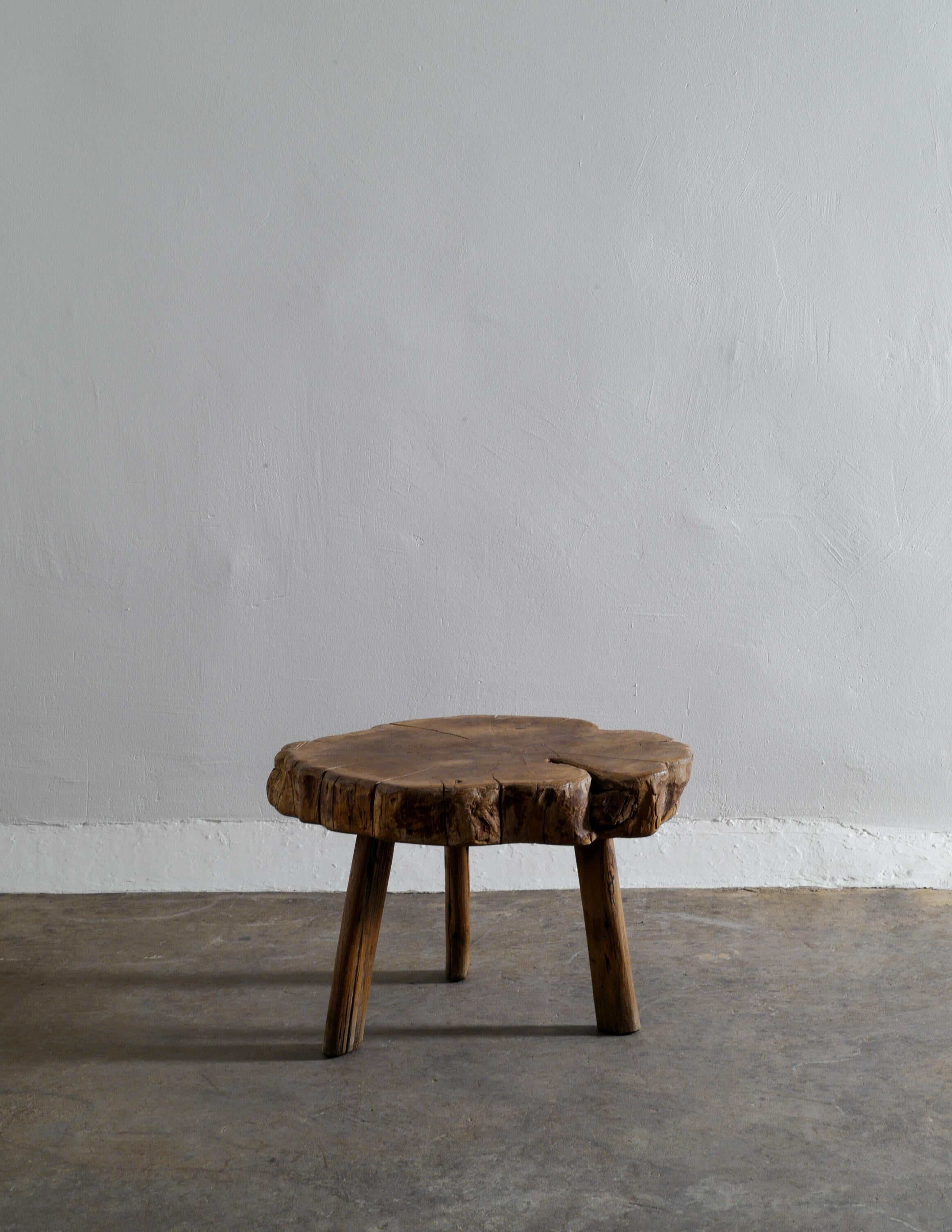 Rare and very beautiful little coffee or side table made out of solid wood and produced in France in the 1960s. 
In good vintage condition with some signs and patina from age and use. Stable and good to use.