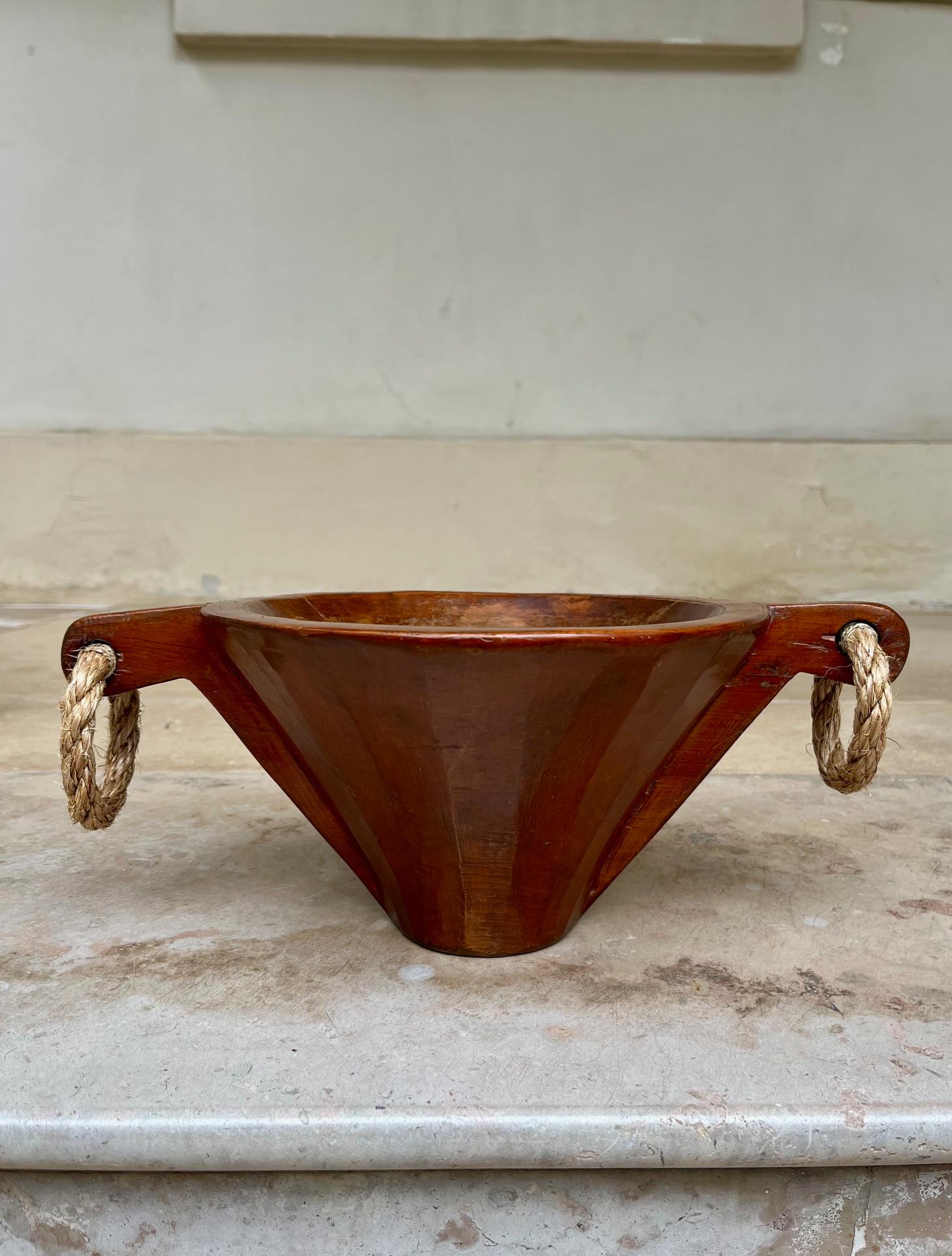 Unusual and decorative urn or vide poche
Conic shaped, 2 handles with rope rings. 
Gouge hand-carved walnut, rich patina. 
