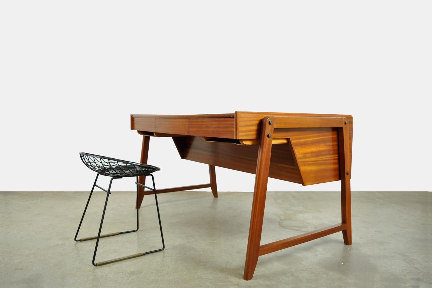 Unique and beautiful wooden design architectural firm, designed by Clausen & Maerus and produced in the Netherlands by Eden in the 1960s. 
The large desk has 3 drawers at the front with two storage compartments underneath, and three deep