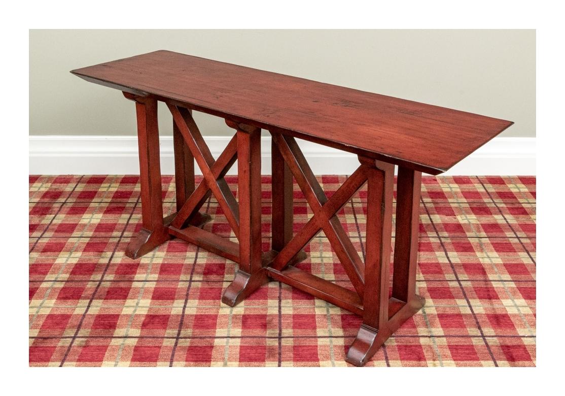 Fine quality Woodland Furniture sofa or console table with X-form supports, intentionally distressed and resting on a trestle base.
Dimensions: 20