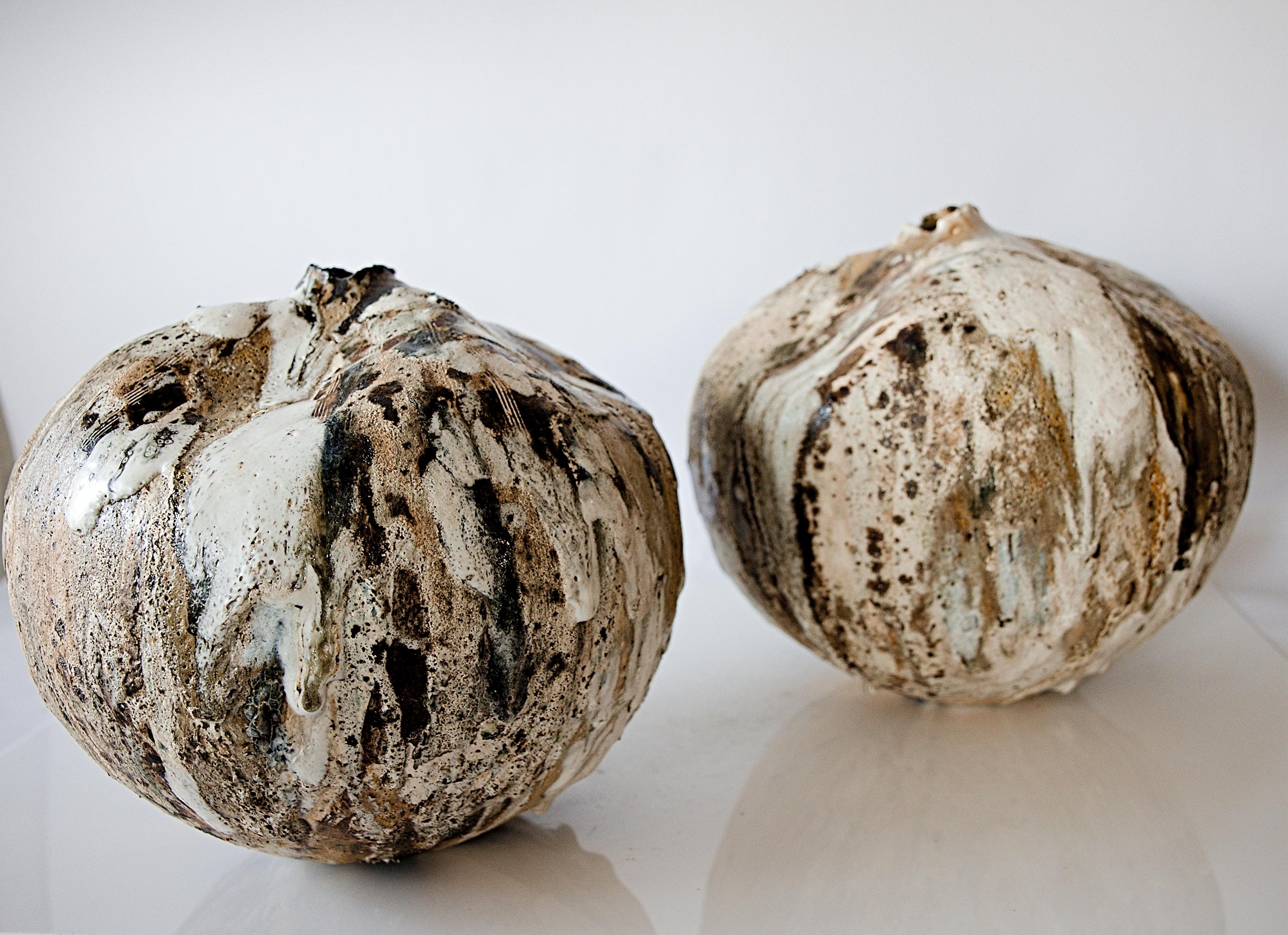 Experience the unique beauty of the Woodland Organic Moon Shape Vessel
at The Shine Studios, where organic modern with color, texture, and many layers of custom glazes create a captivating aesthetic. Crafted by our artisan April, each vessel is one