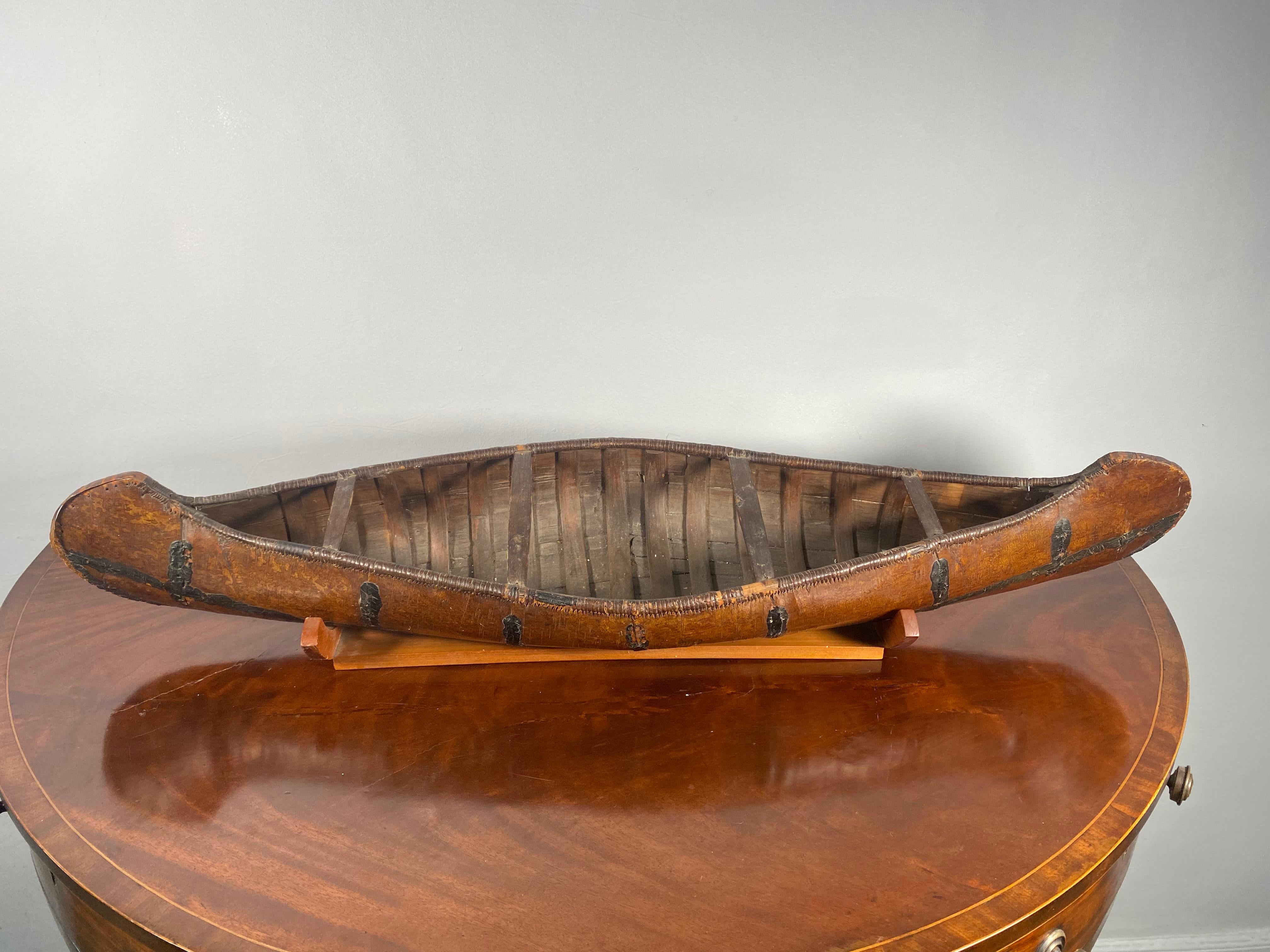 A wonderfull example of a birch bark model, North American probably Algonquin, late 19th Century - on a later shaped stand.