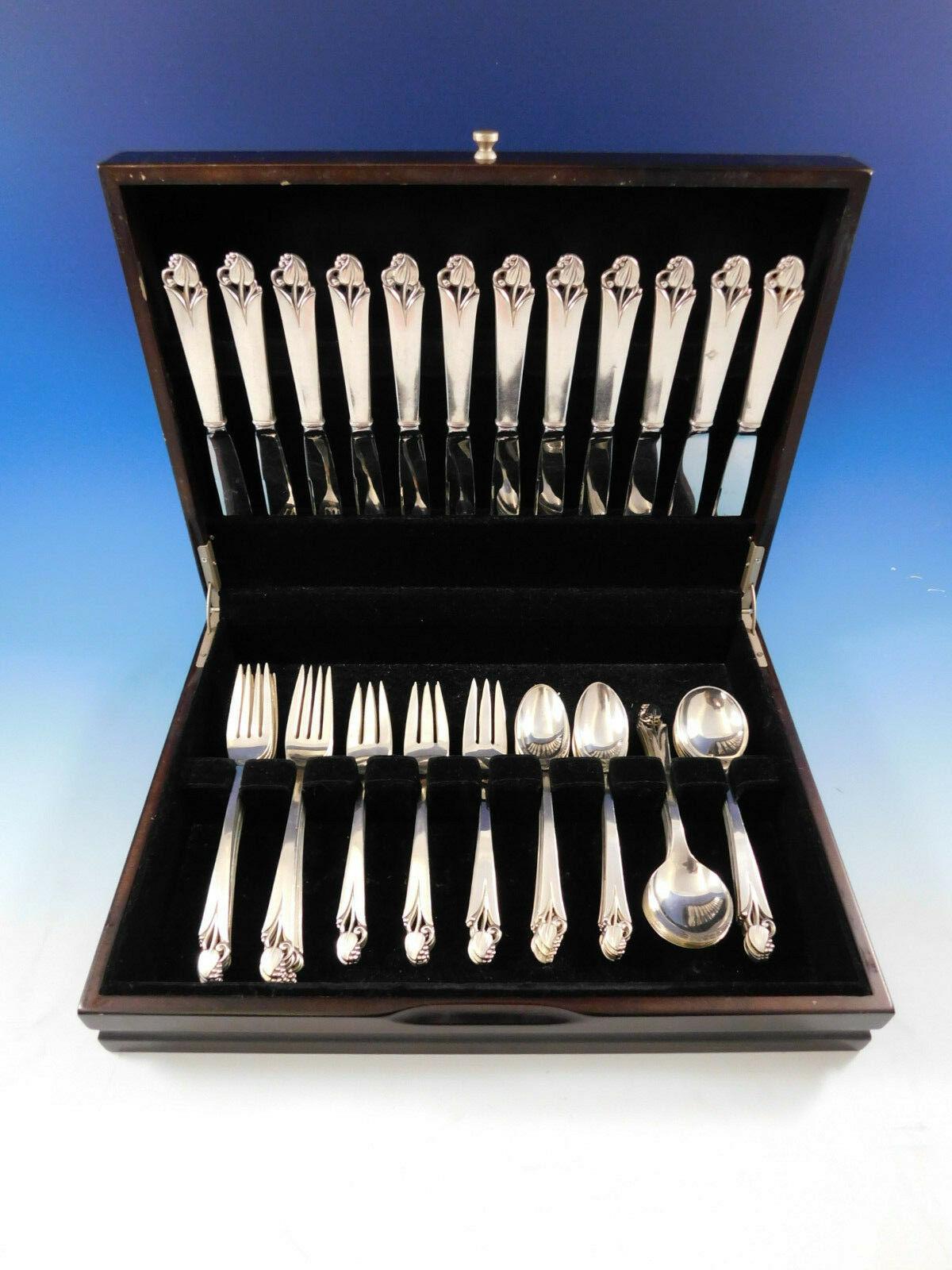 Woodlily (glossy) by Frank Smith sterling silver flatware set, 60 pieces. This graceful pattern features a 