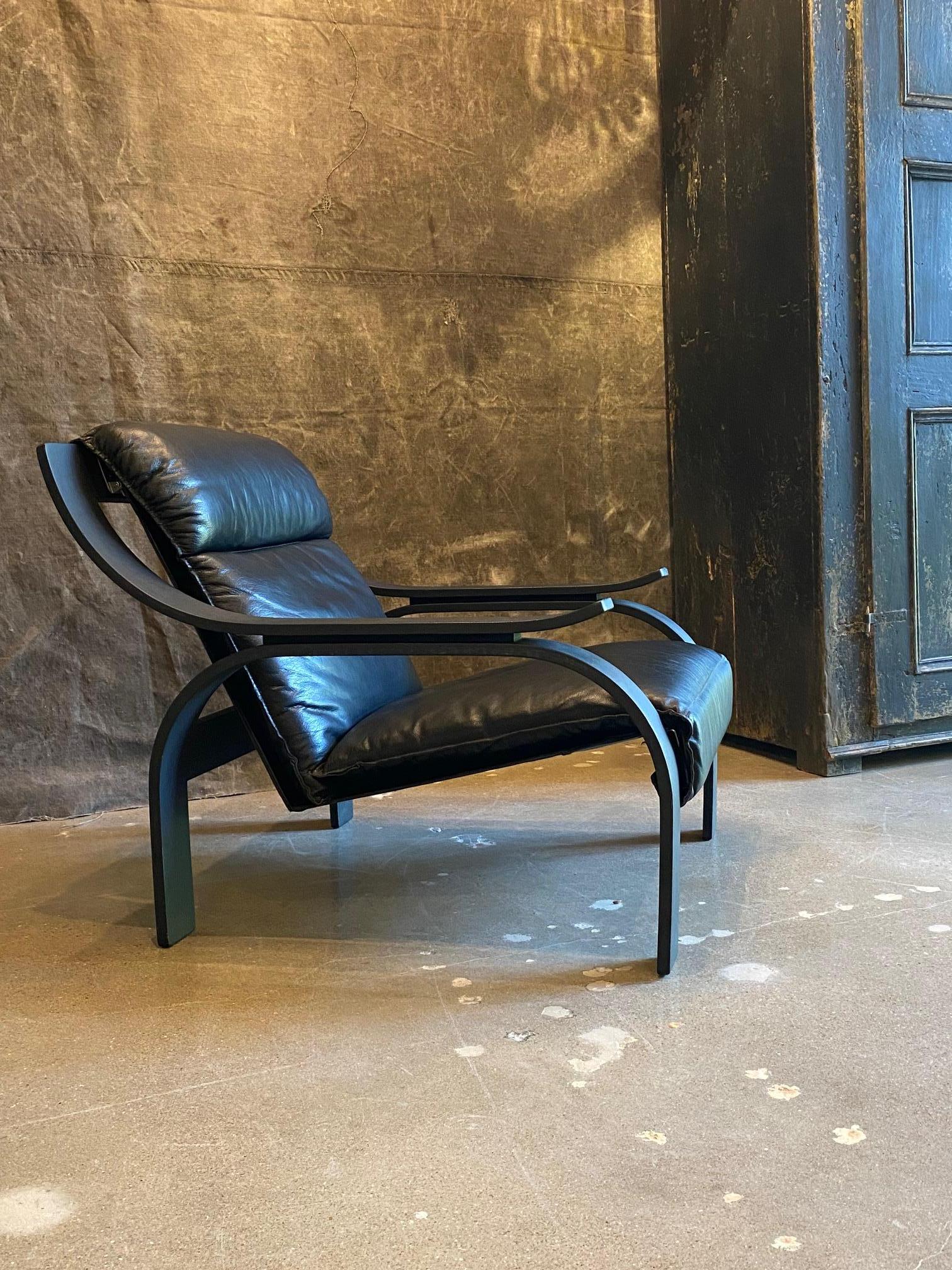 Woodline black calf leather lounge chair by Marco Zanuso for Arflex.  Supple original black leather upholstery sits within a bent plywood matte black frame.  Very comfortable.  Italy, 1970's 
