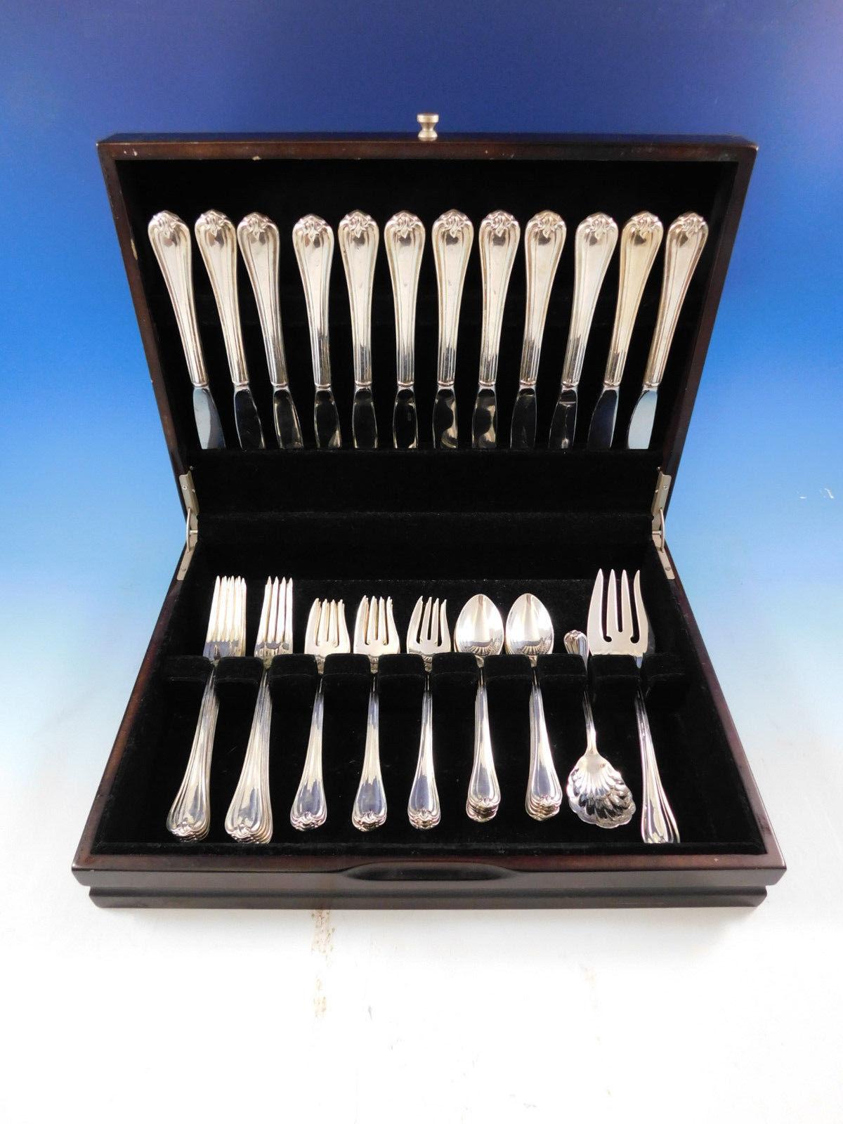 Woodwind by Reed & Barton sterling silver Flatware set, 50 pieces. This set includes:

12 knives, 9