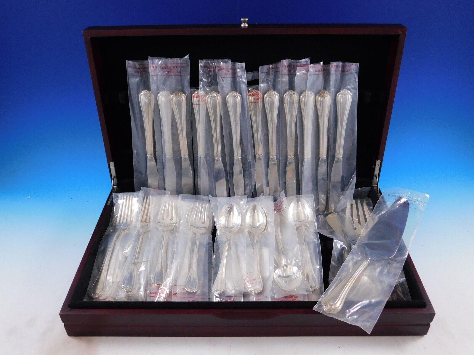 Unused Woodwind by Reed & Barton Sterling Silver Flatware set - 63 pieces. This set includes:

12 Knives, 9