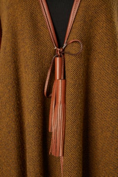 Wool and cashmere Poncho with leather piping and pompom Hermès Sellier