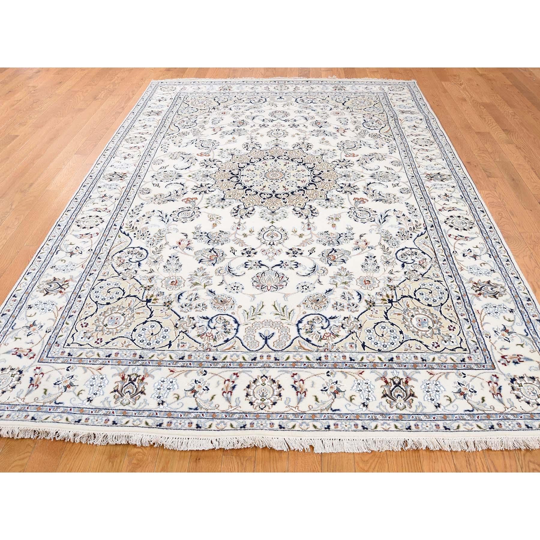 This is a truly genuine one-of-a-kind wool and silk 250 Kpsi ivory Nain hand knotted Oriental rug. It has been knotted for months and months in the centuries-old Persian weaving craftsmanship techniques by expert artisans. Measures: 6'0