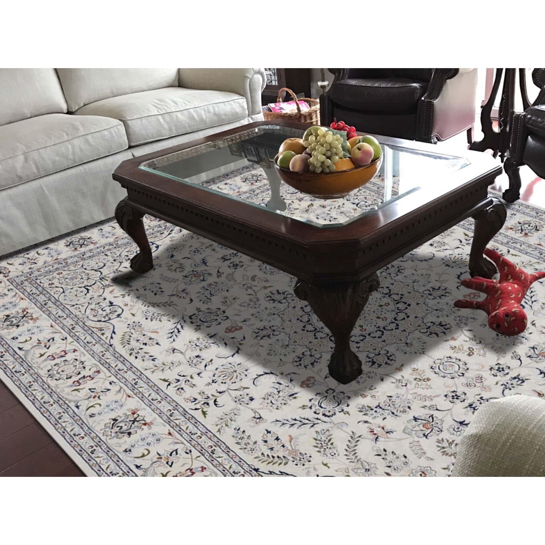 This is a truly genuine one-of-a-kind wool and silk 250 Kpsi ivory Nain hand knotted Oriental rug. It has been knotted for months and months in the centuries-old Persian weaving craftsmanship techniques by expert artisans. Measures: 8'6