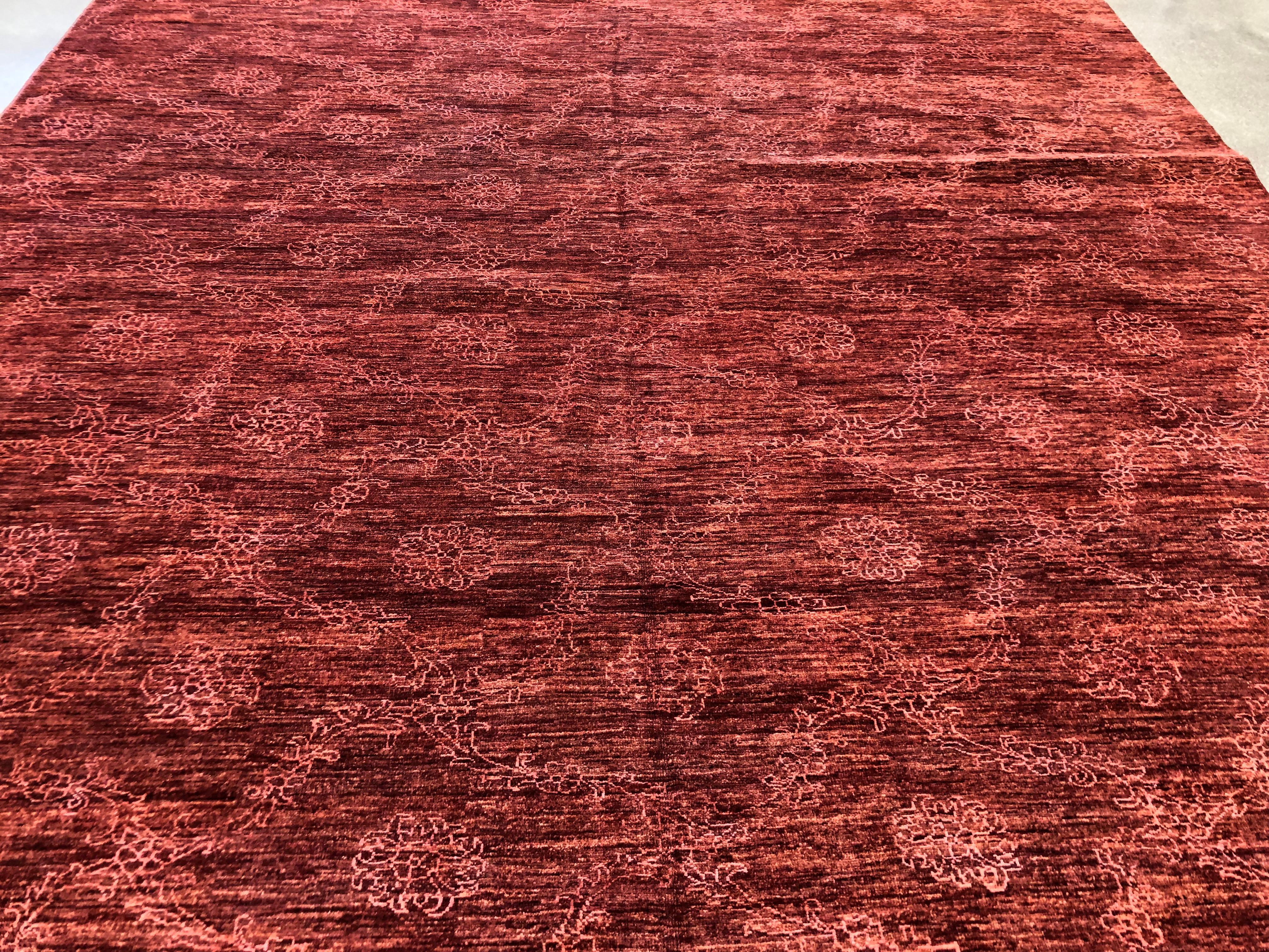 This all over trellis design with floral pattern is a combination of wool and silk materials. Its overdyed look makes this rug luscious and rich and yet can be simple enough to easily match with furniture for your space. This rug is handmade, and