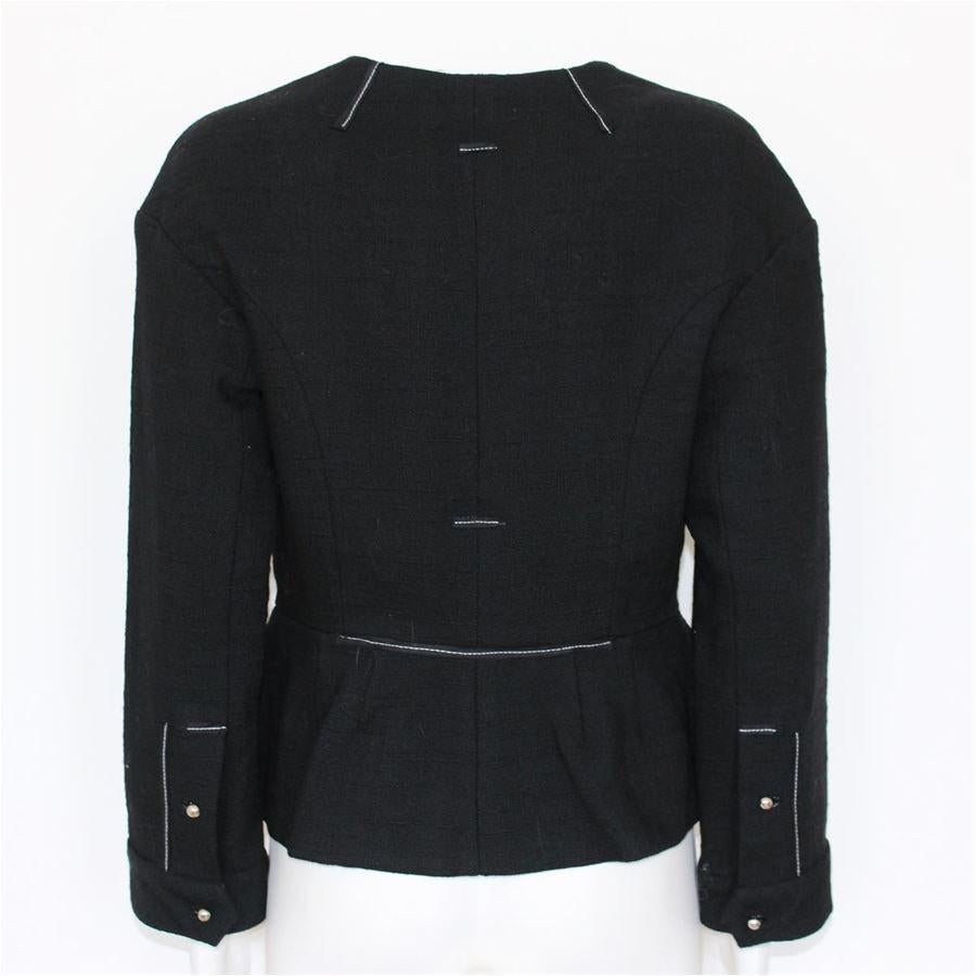 100% Wool Black color Six pockets Studs applications Visible stitching Zip closure Length from shoulder cm 50 (19.6 inches) Size 6
