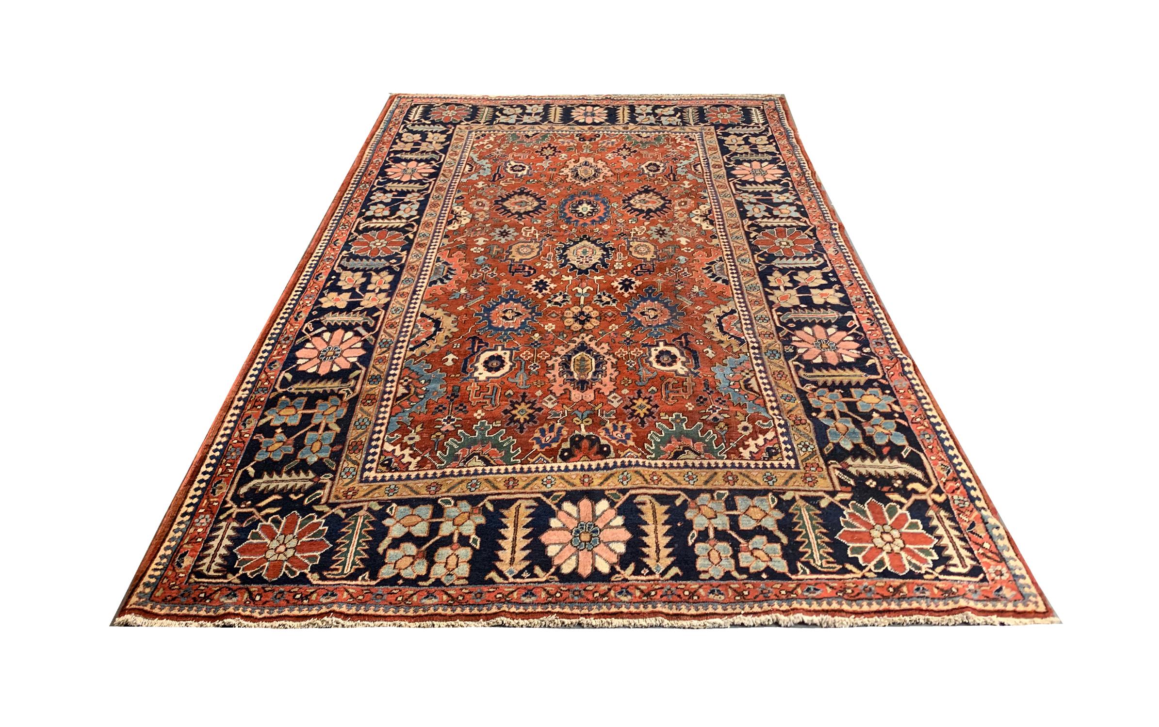 This grand hand-woven wool rug was woven in Azerbaijan in the 1880s. Woven with a beautiful colour palette including rust, blue, brown and black accents that make up an elegant symmetrical medallion design. Framed by a bold repeating pattern border.