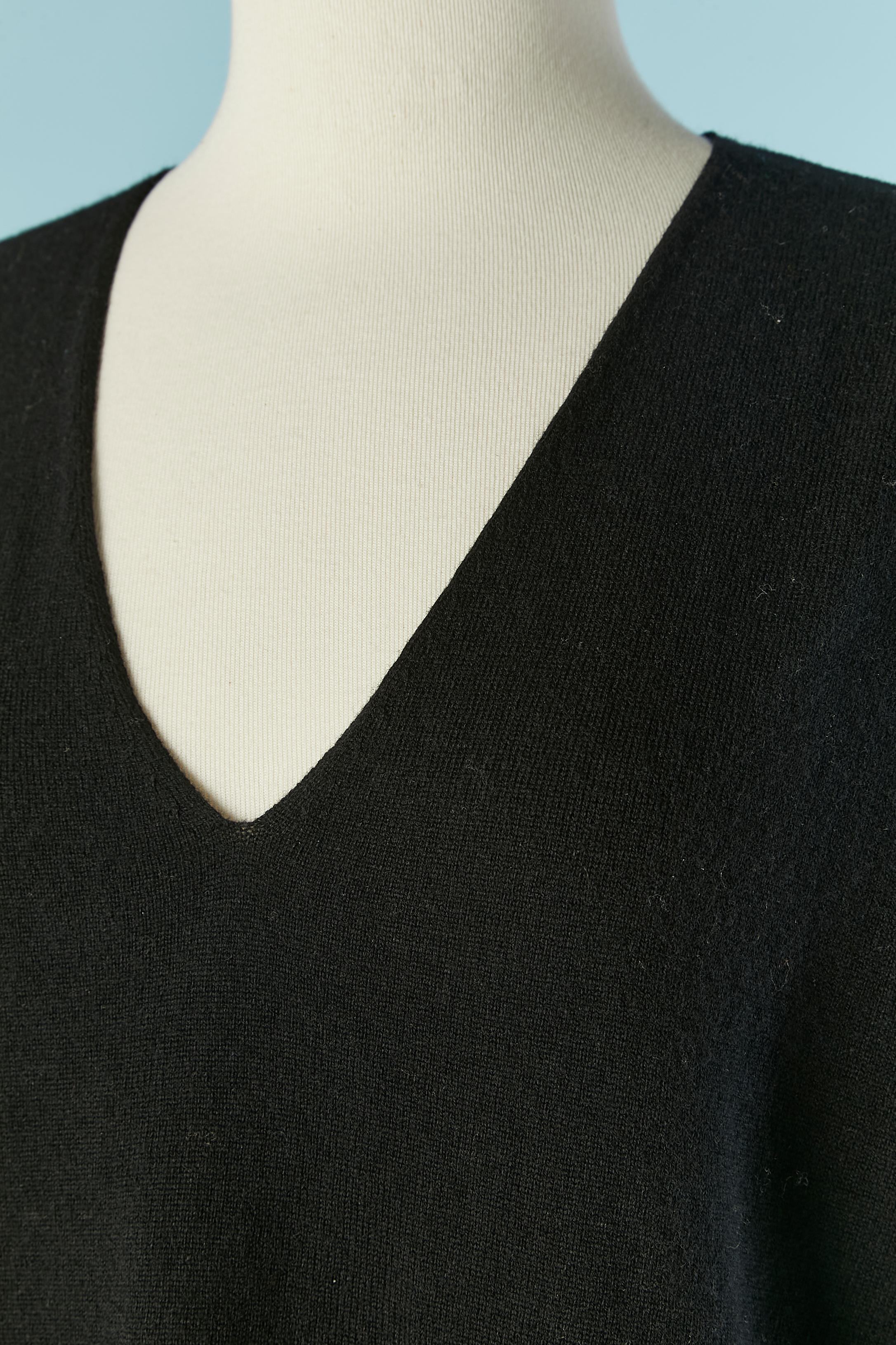 Wool black sweater with V neckline . New with tag. Extra threat provided. 
Lenght middle back= 70cm
 Lenght middle front= 66cm
SIZE S on tag ( if it's wear like oversize) can also fit M 