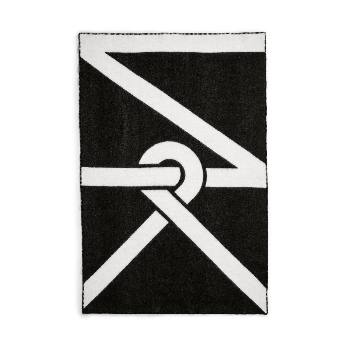Our logo design creates a bold pattern that looks stunning both in full and when folded or thrown over your furniture. The blanket is woven to be as beautiful on the back as the front but with inverted colors on each side.
