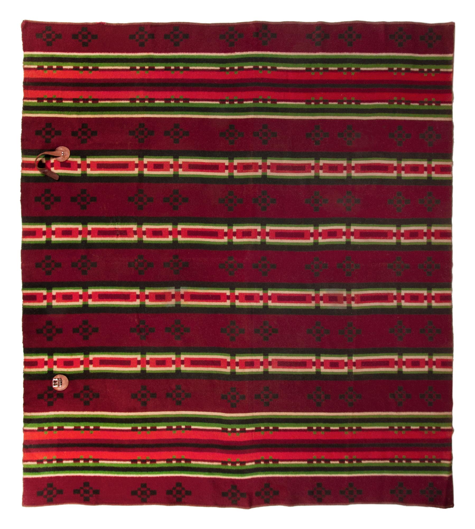 Loom-woven horse blanket, made circa 1890-1910. The striped and geometric pattern consists of lime green, sunfire red, and ivory, against winter/summer, reversible grounds of forest green and burgundy. Constructed of wool and cotton, the long edges
