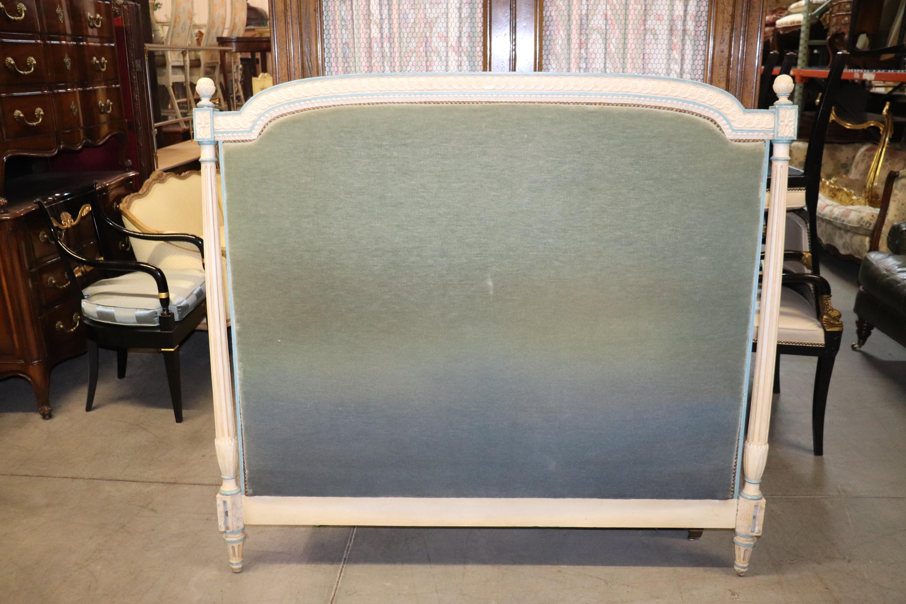 This is a fantastic vintage French Louis XVI headboard and footboard. There are no rails, but it can be used with a metal frame as a conventional queen size bed. The bed is upholstered in its original bluish faded wool mohair and is in good