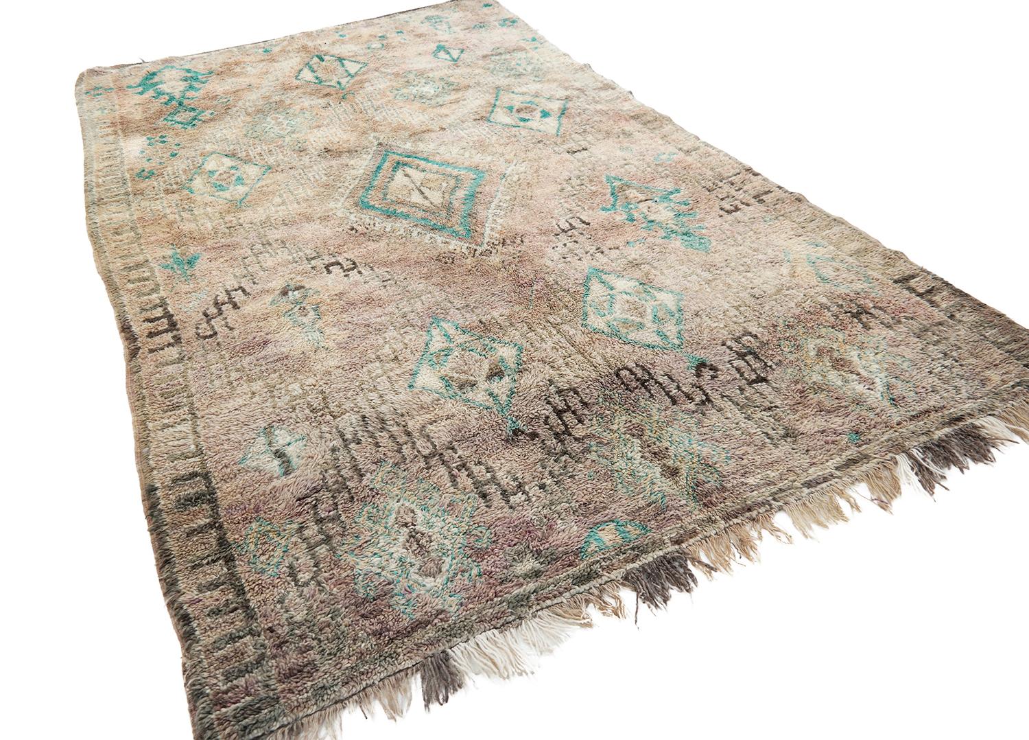 This rug is the beauty of the beauties. The most pretty color shades and with beautiful made Berber symbols. She feels very soft and luxury under your feet. Depending the light you see different shades of aubergine, beige, sand, purple, brown and