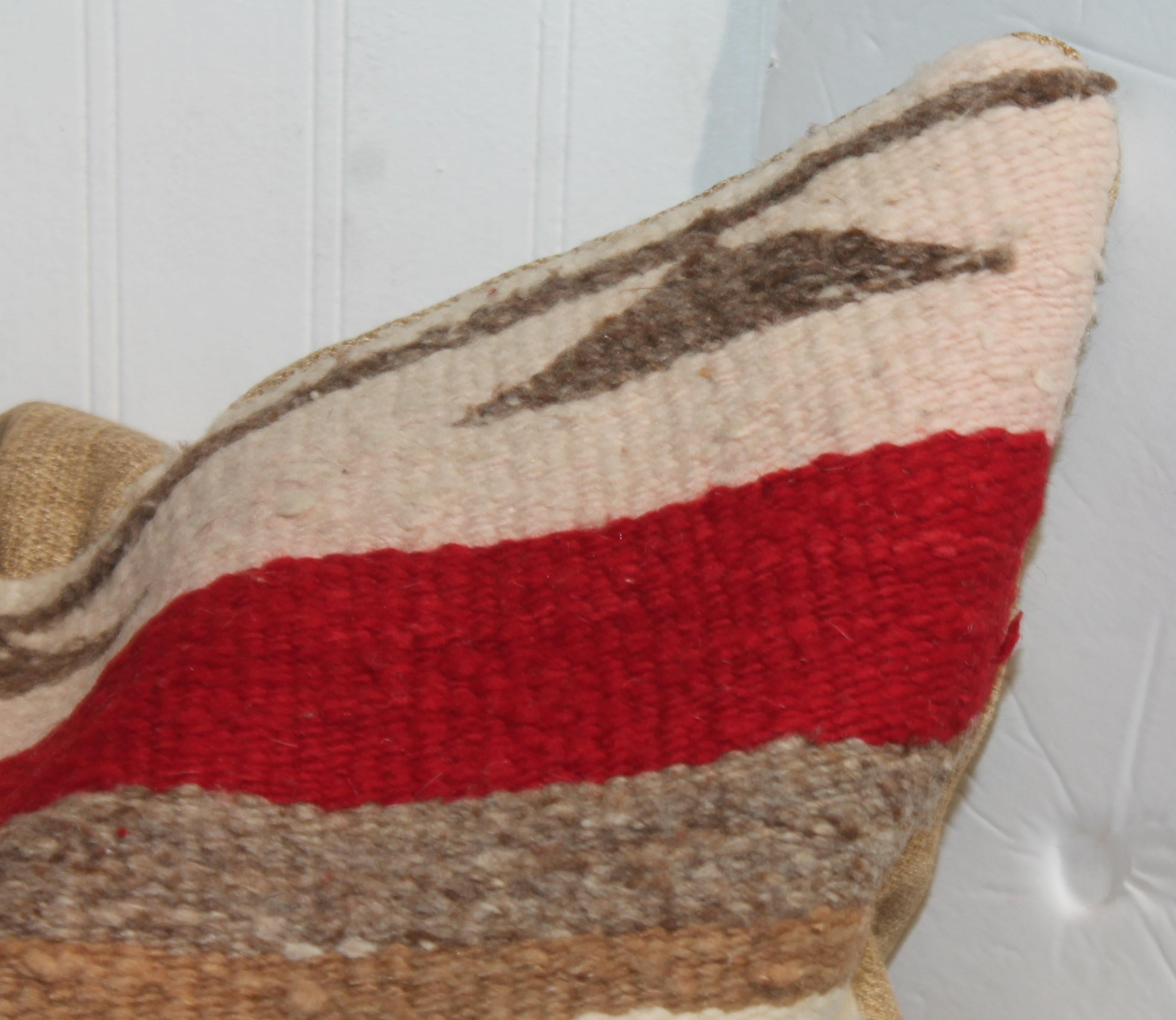Red and white striped Navajo wool pillows. Striped vertically with square design corner. Vintage linen backing with down and feather insert. All wool navajo design.