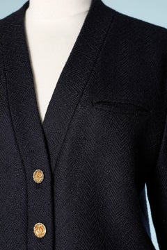 Wool navy blue skirt suit with branded buttons Chanel