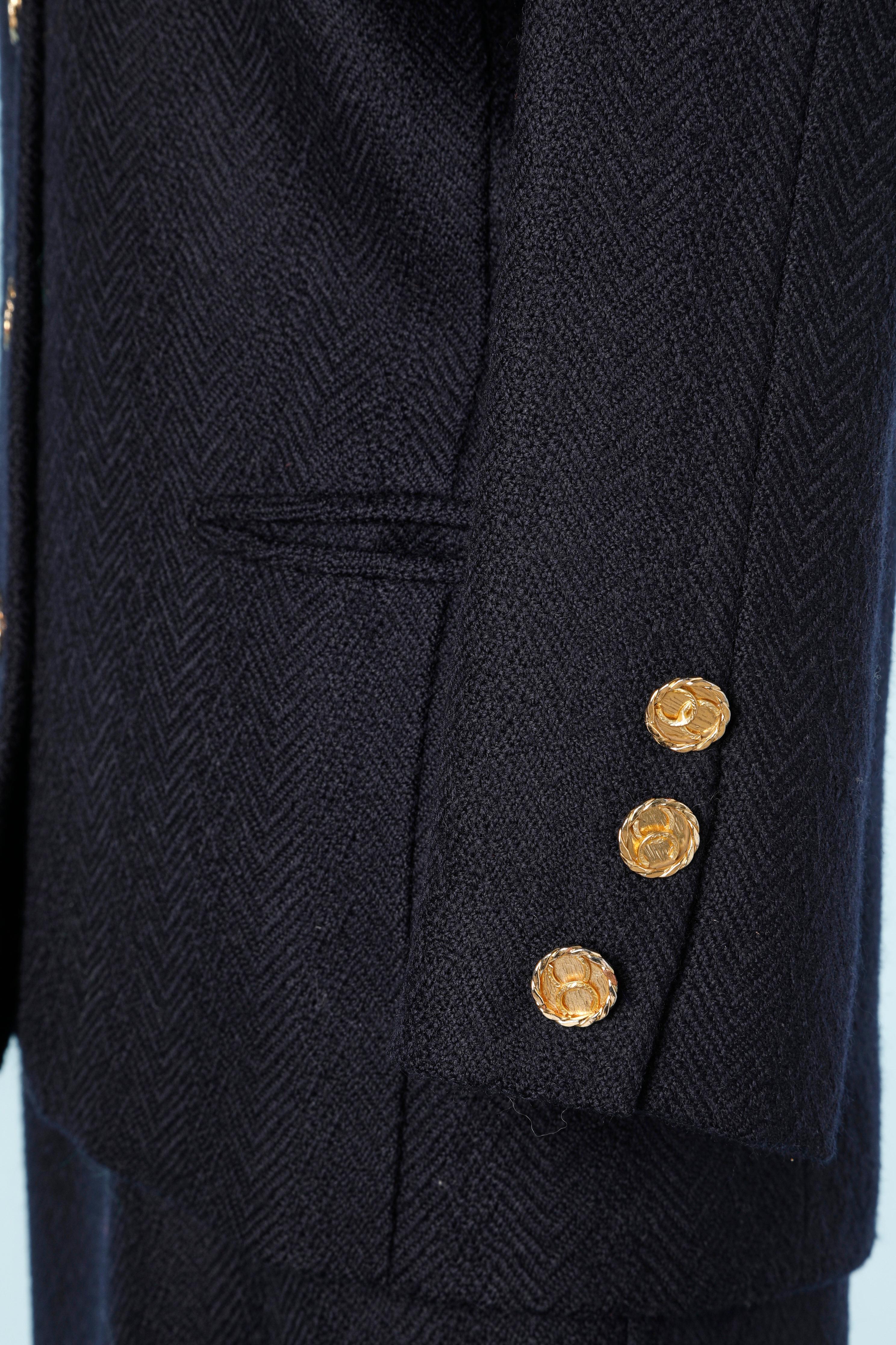 Wool navy blue skirt suit with branded buttons Chanel  In Good Condition For Sale In Saint-Ouen-Sur-Seine, FR