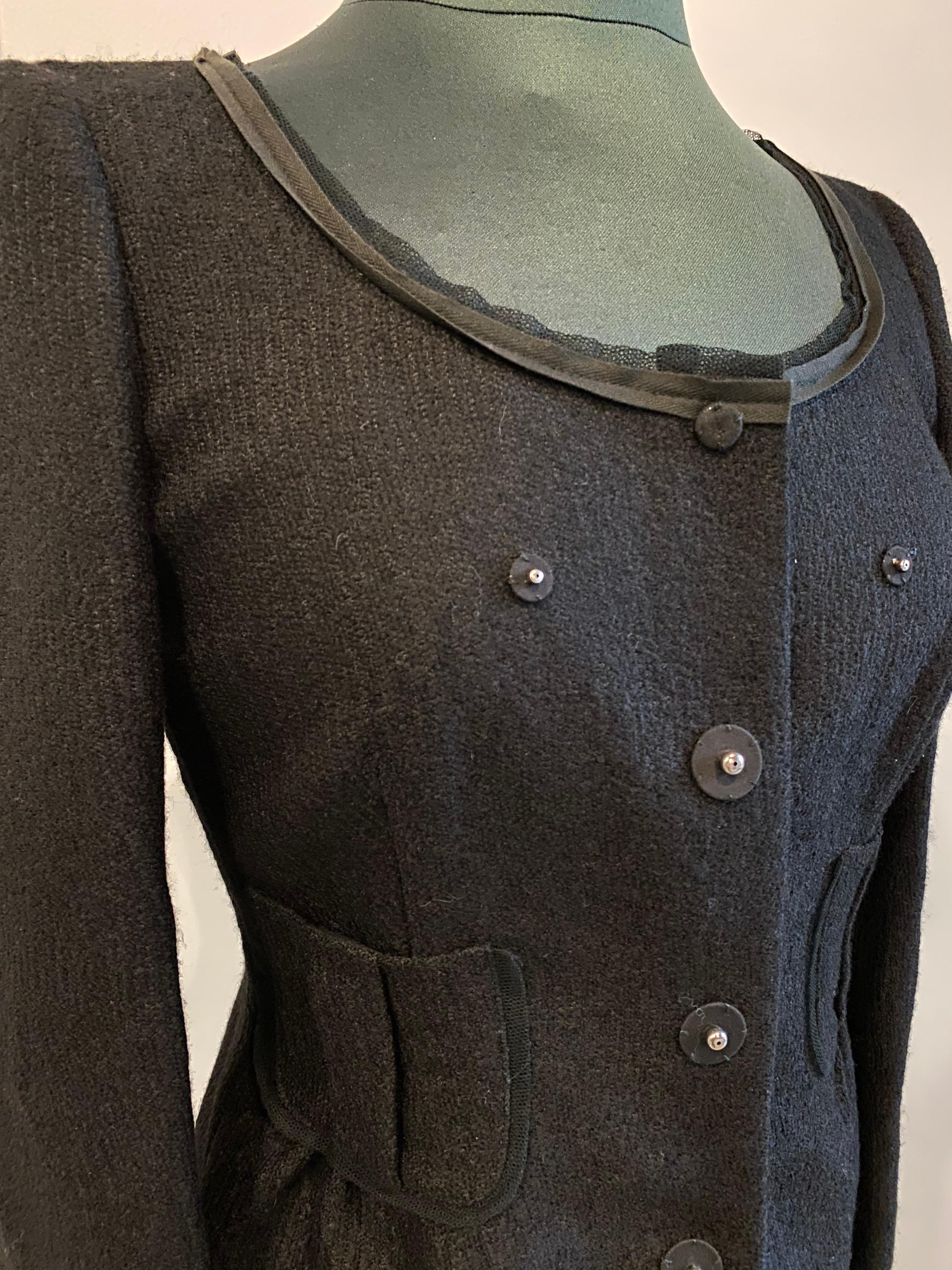 Prada fitted jacket
in viscose wool and nylon.
With exposed silver buttons and pockets.
Italian size 42.
Shoulders 39
Breast 41
Waist 43
Sleeve length 60
In excellent general condition.