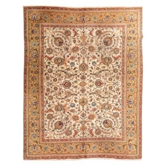Wool rug. Classic Tabriz design with yellows and golds. 3.75 x 2.90m