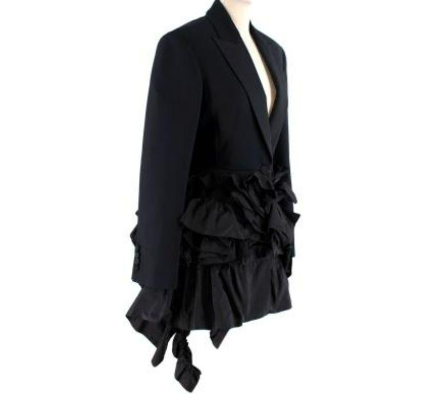 Alexander McQueen Wool-Silk Blazer with Silk Faille Ruffles 

- Elegant single-breasted wool-silk blazer jacket with a single button, decorated with voluminous silk faille ruffles across the hip and back
 - Fully lined
 
 Materials 
 63% Wool
 25%