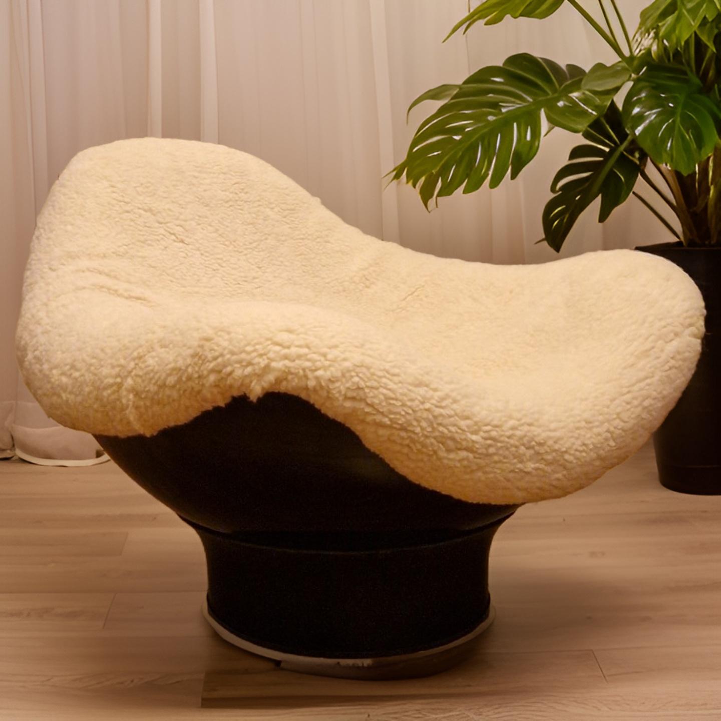 Space age lounge chair. Made from fiberglass. The shell stands on a trumpet base and can be moved in any direction. 

Designed by Mario Bruno in 1964 and produced by Comfort, Italy. Also known for the iconic Elda chair by Joe Colombo. 

An Italian