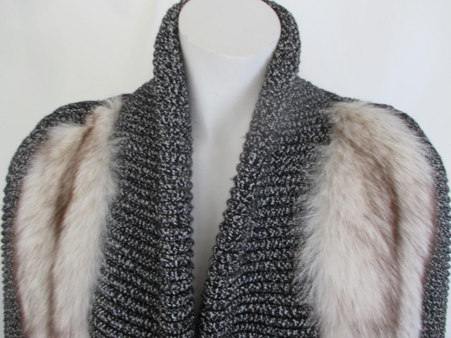 Fabulous original vintage 80/90s grey wool coat with fox fur

We offer more exclusive fur items, view our frontstore

Details:
Black and white blend knitted wool with white fox fur
1 loose button and 2 pockets.
Fully lined
Pre owned
Size fits as