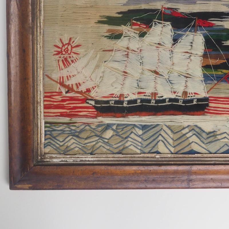 Wool work sailing ship also known as Woolies, of a British sloop circa 1860. 

An embroidered ship Portrait of a 14 gun Royal Navy Sloop of war showing 7 gun ports on its broadside. Sloops of war were a single deck ship that carried up to 18