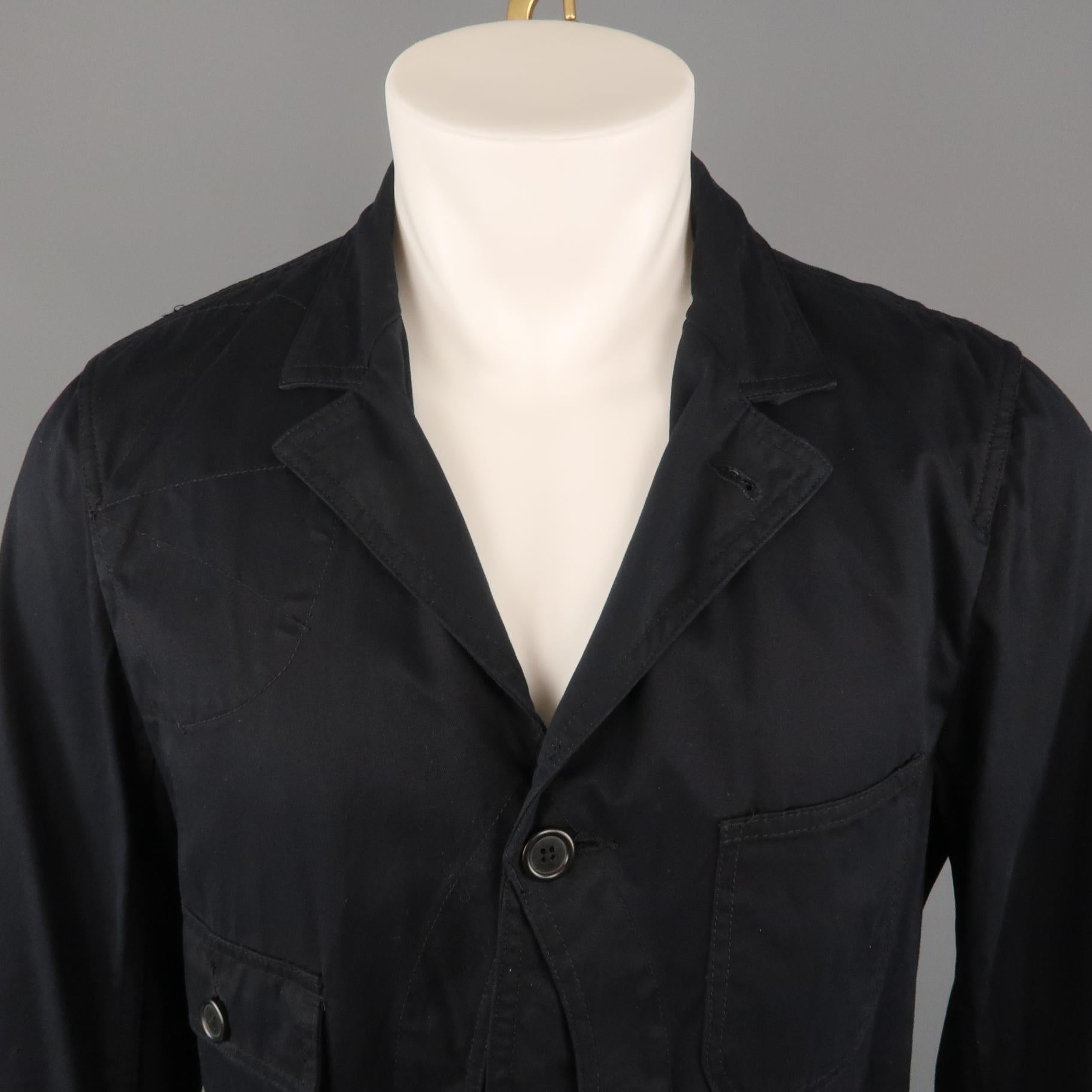 WOOLRICH jacket comes in a black cotton featuring a notch lapel, patch pocket details throughout, and a buttoned closure. Made in USA
 
Excellent Pre-Owned Condition.
Marked: M
 
Measurements:
 
Shoulder: 17.5 in.
Chest: 40 in.
Sleeve: 26.5