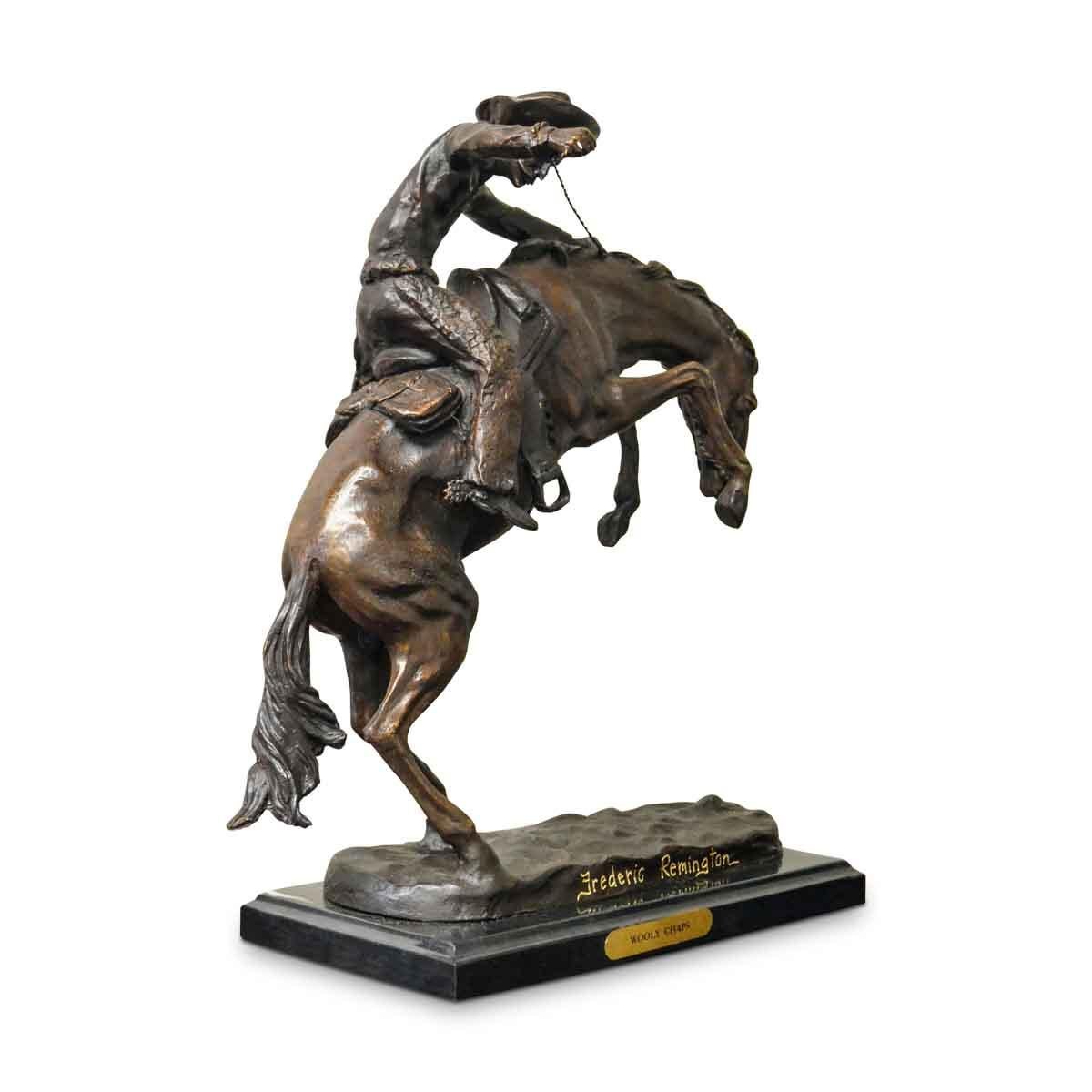 Wooly Chaps, a cast bronze sculpture after American artist Frederic Remington on marble base. A variation of his most famous sculpture, The Broncho Buster, Wooly Chaps is filled with a tremendous dramatic tension and depicts a scene from the